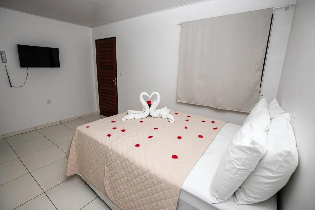 Bed in Pousada Paris