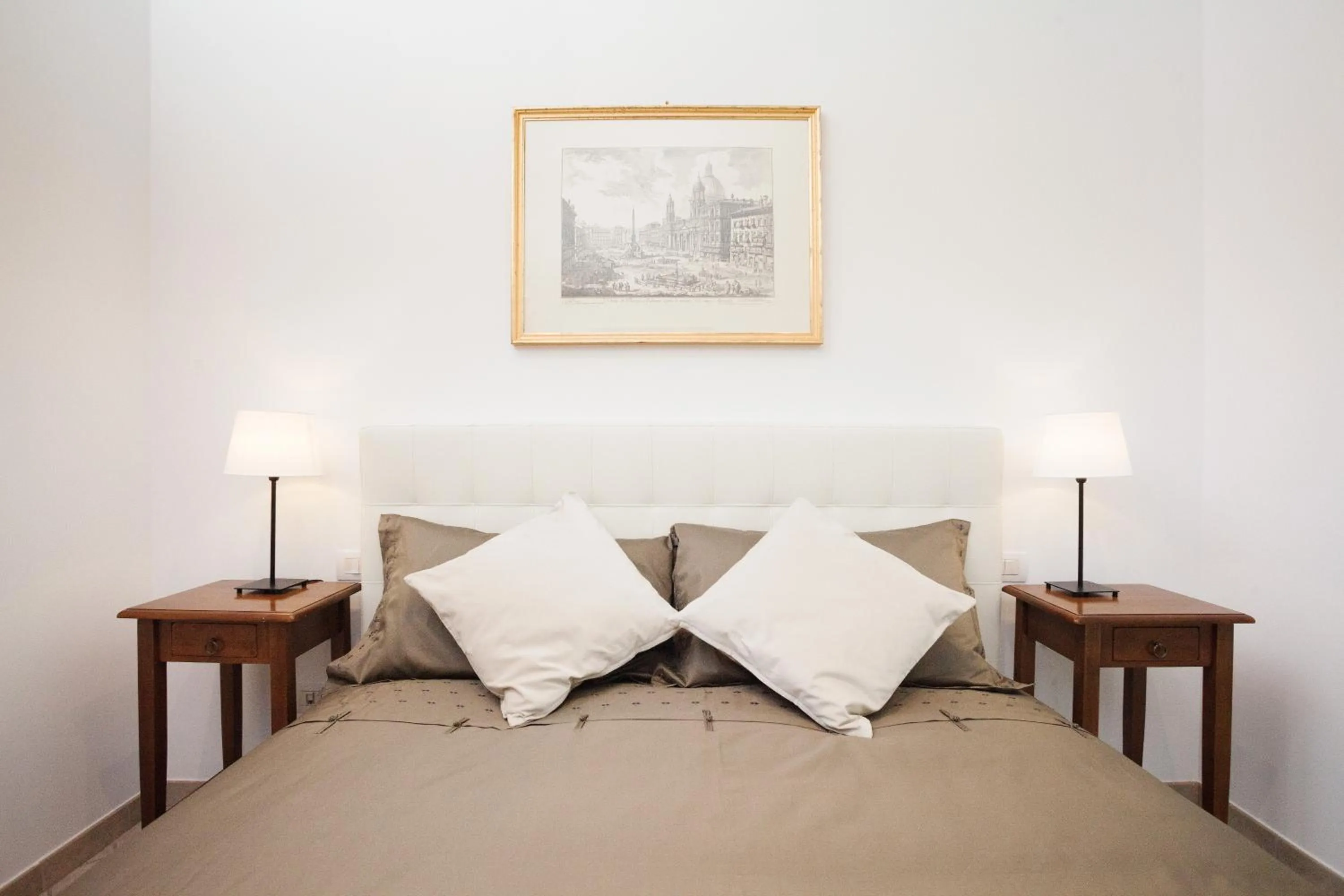 Bed in Tritone 91 Apartments