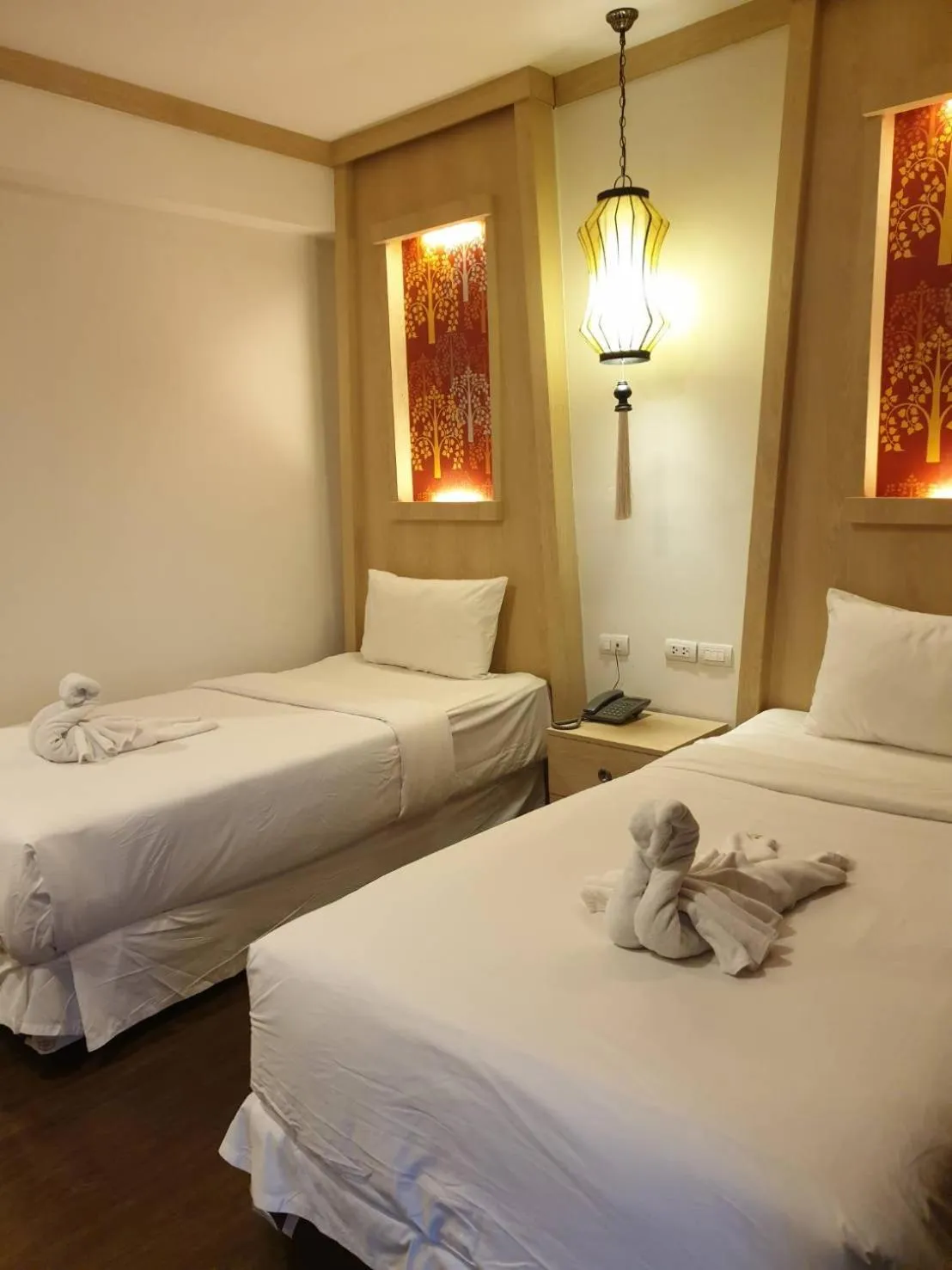 Bed in The Wing Lanna Hotel