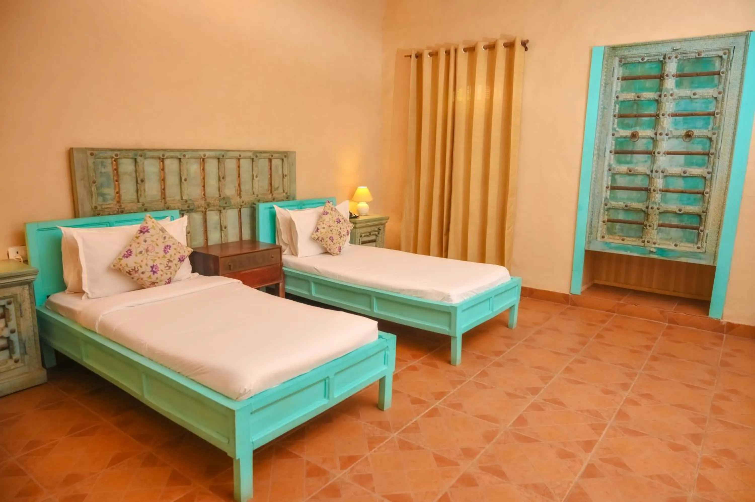 Bed in WelcomHeritage Ranjitvilas