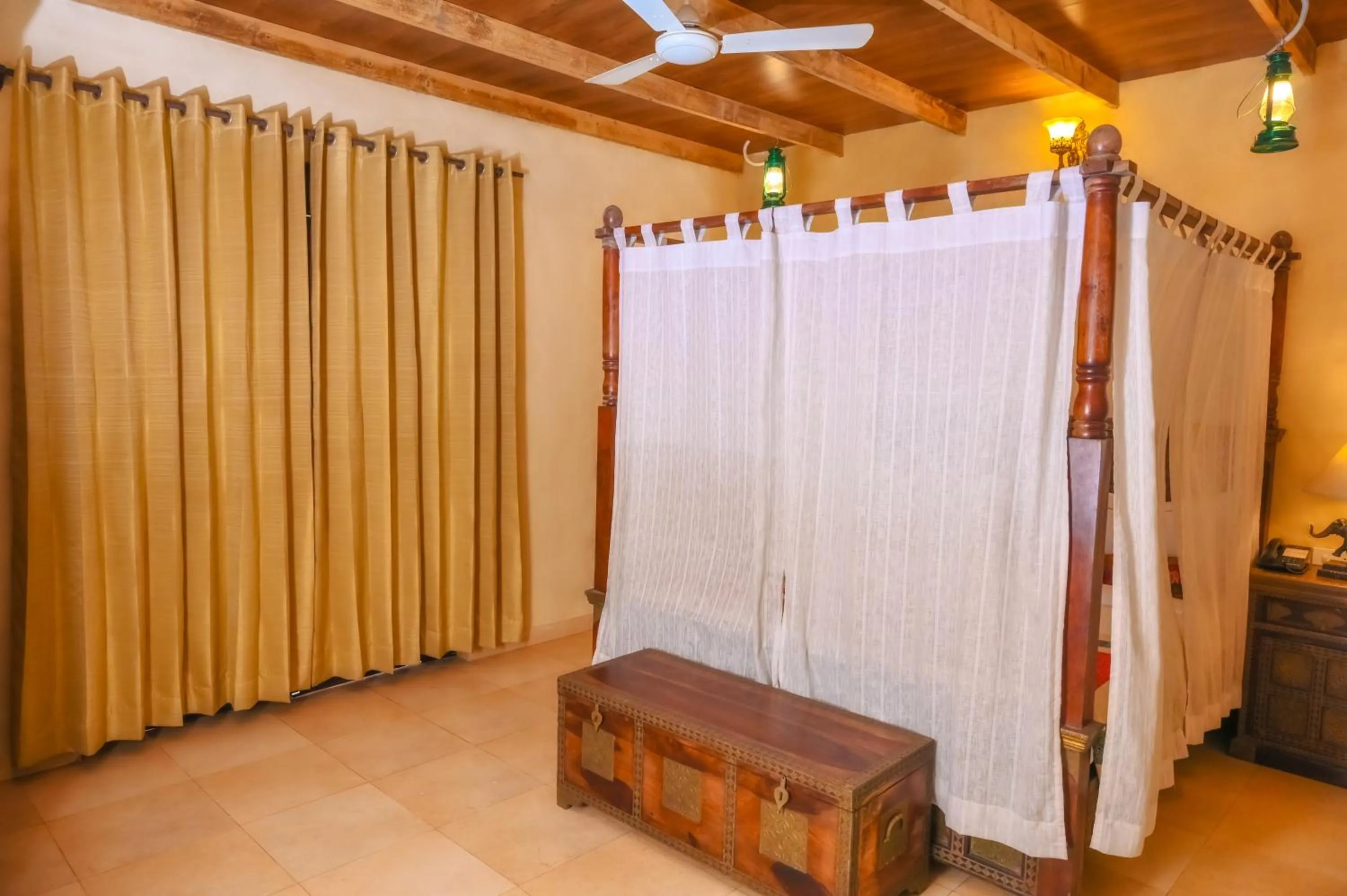 Bed in WelcomHeritage Ranjitvilas