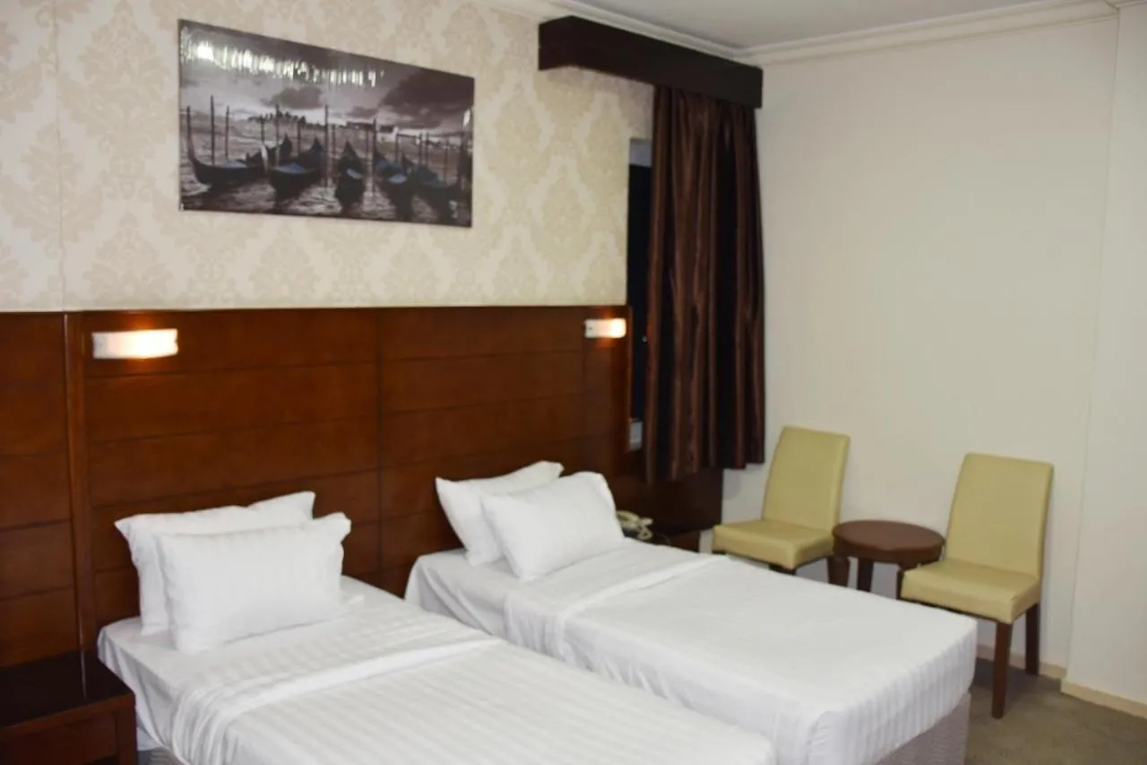 Bed in Mirage Al Salam Hotel