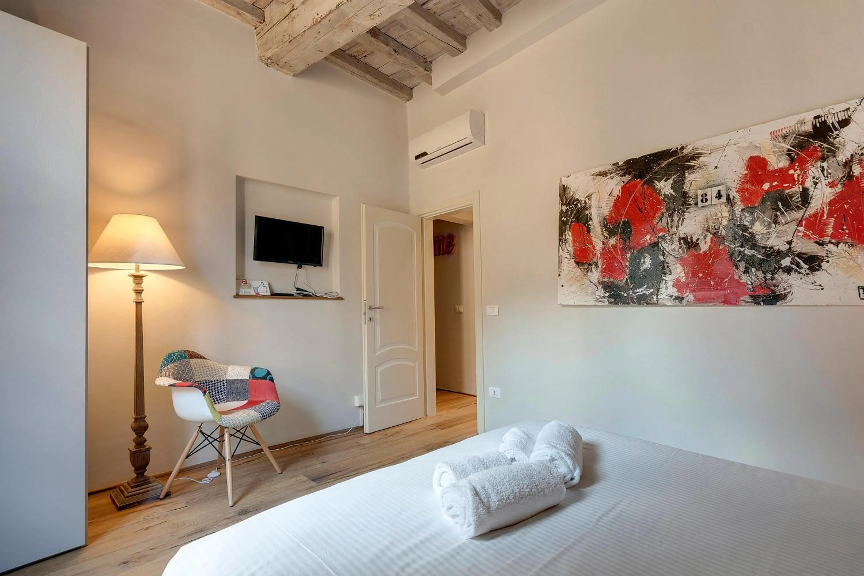 Bed in Boheme Apartment by Mamo Florence