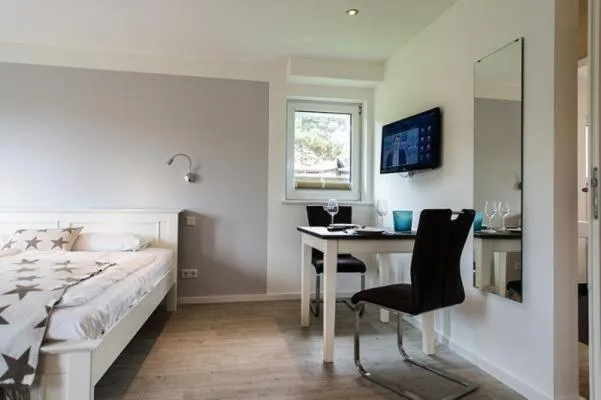 Bed in Gartenwohnung-Landhaus-Tadsen
