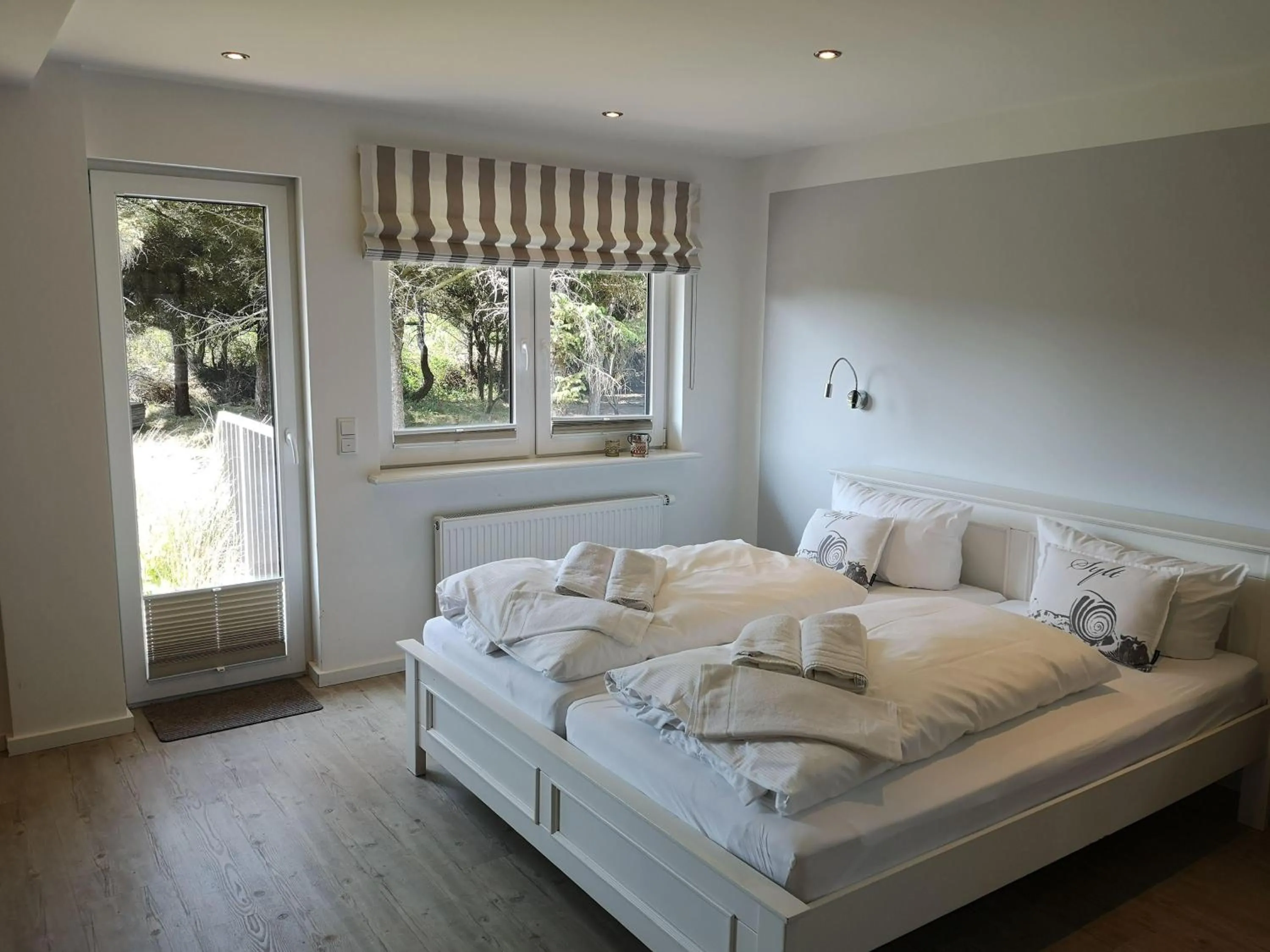 Bed in Gartenwohnung-Landhaus-Tadsen