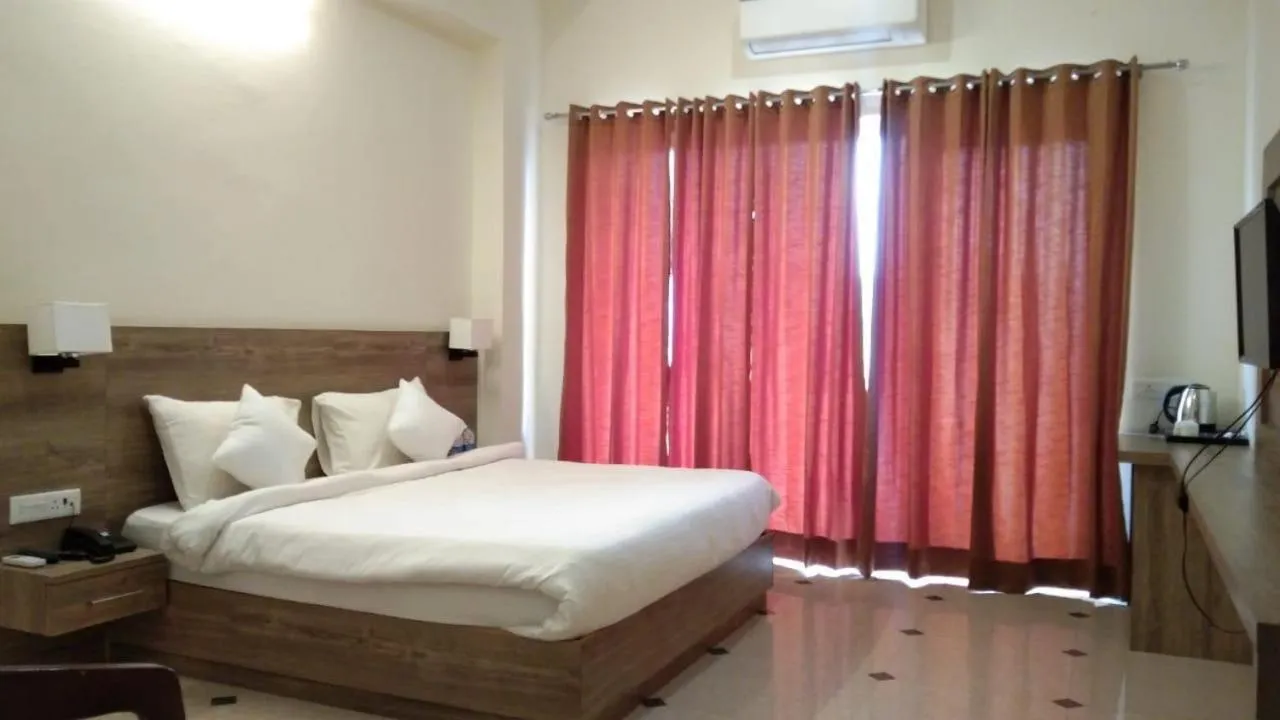 Bed in Dhawala Resort By Aamod