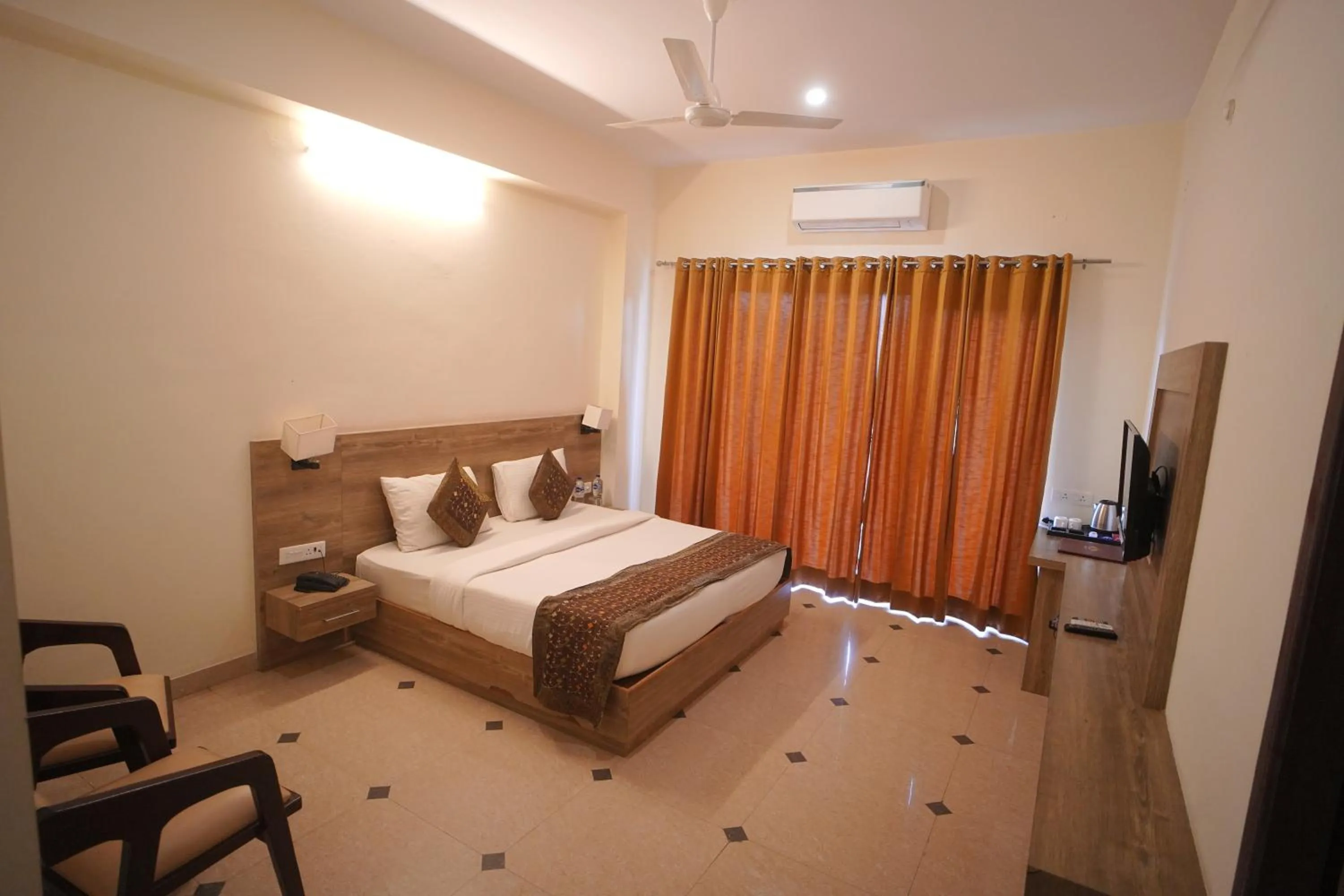 Bed in Dhawala Resort By Aamod