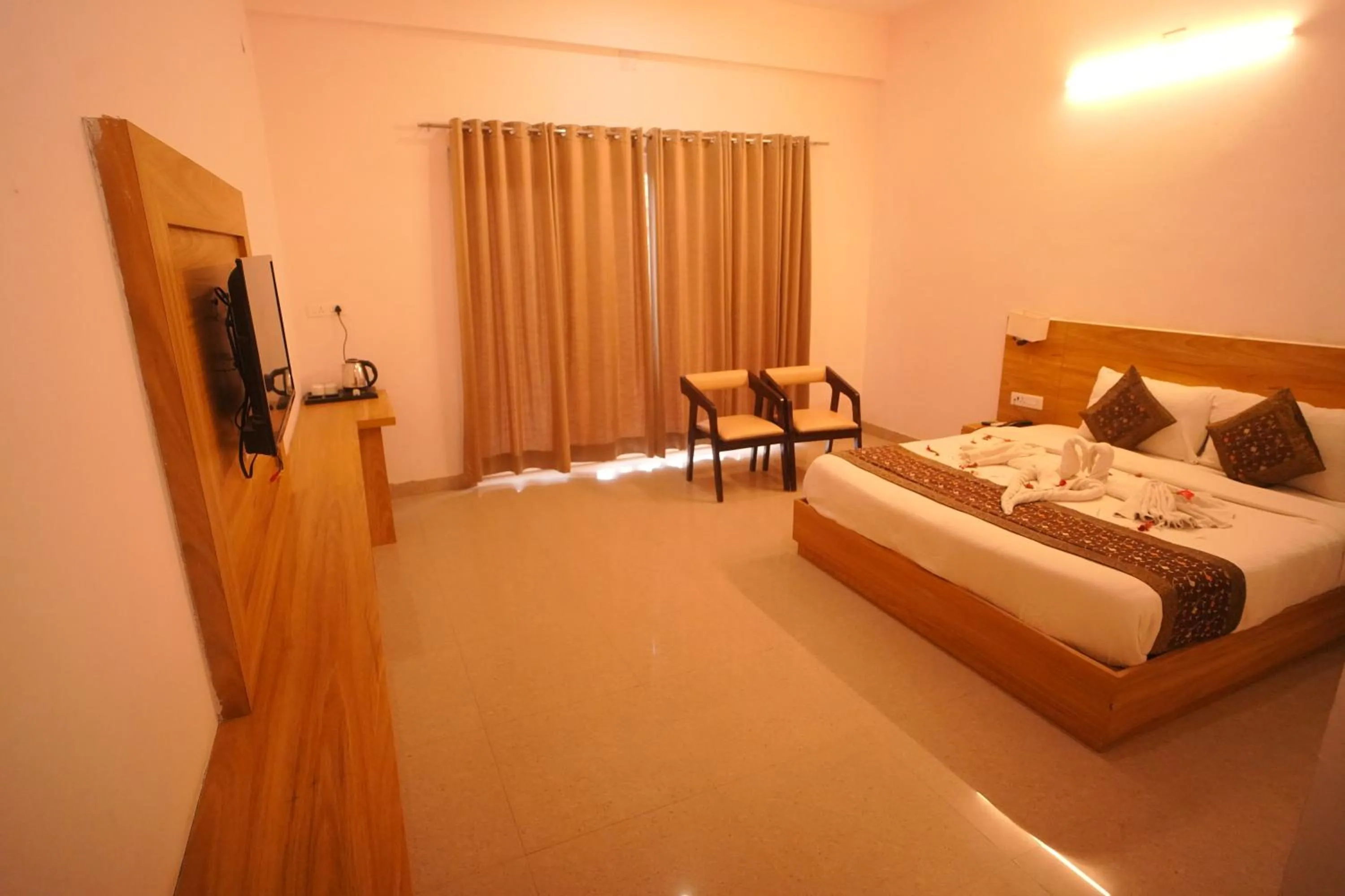 Bed in Dhawala Resort By Aamod