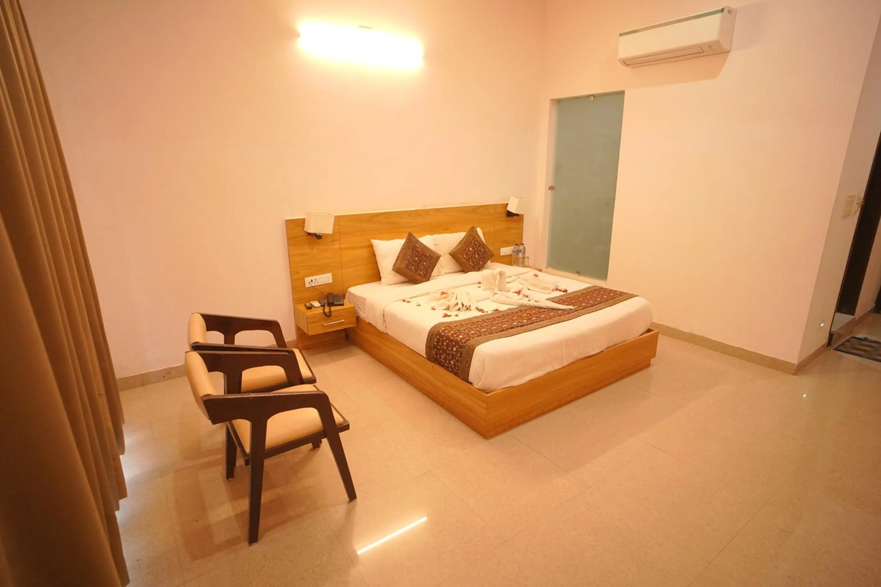 Bed in Dhawala Resort By Aamod