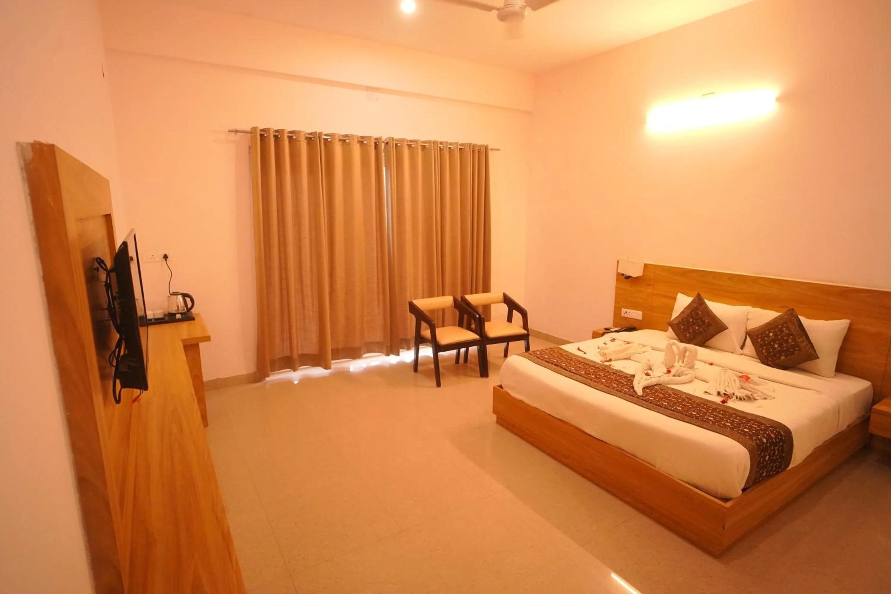 Bed in Dhawala Resort By Aamod