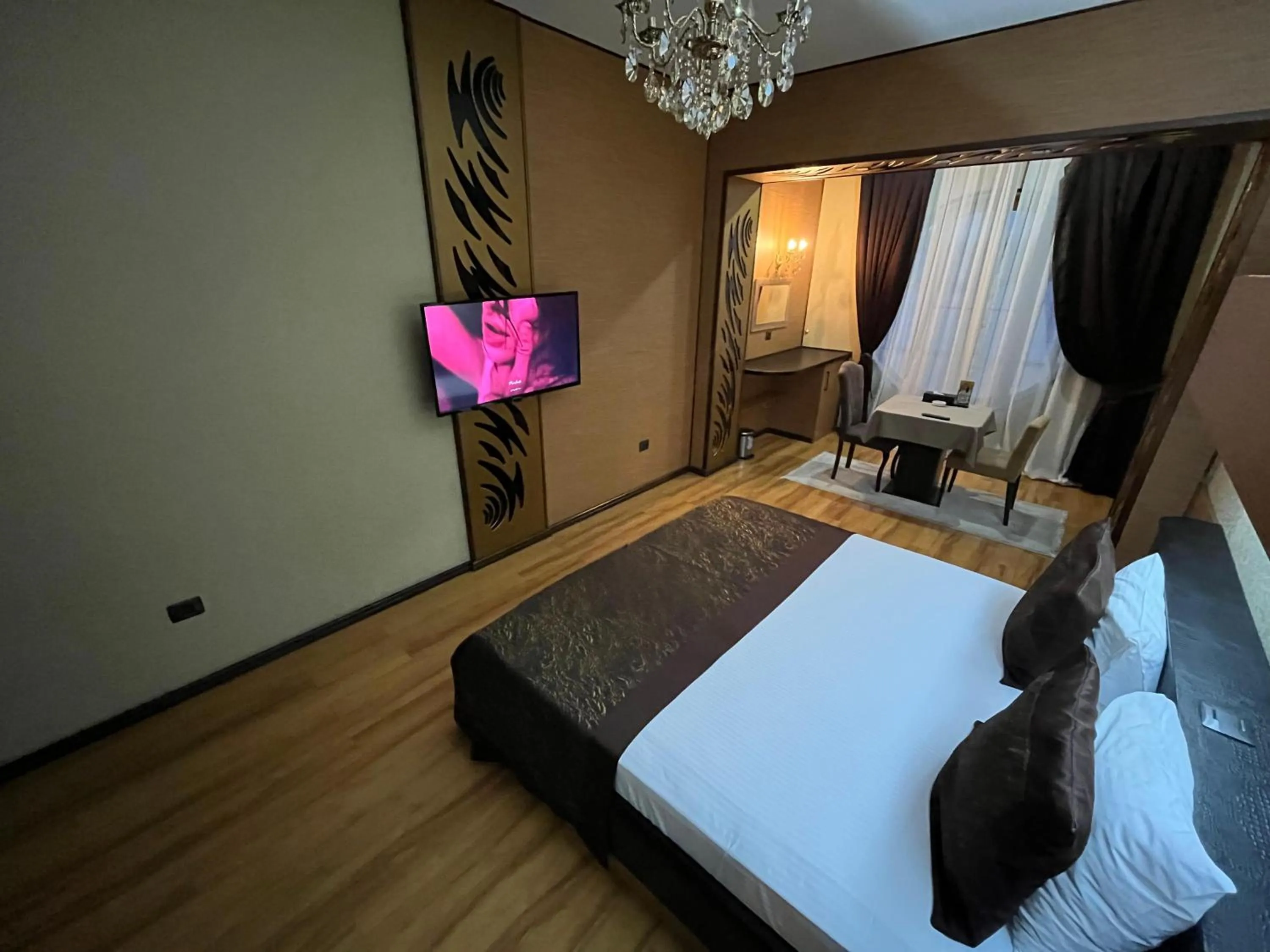 Communal lounge/ TV room, Bed in Bayil Breeze Hotel & Restaurant