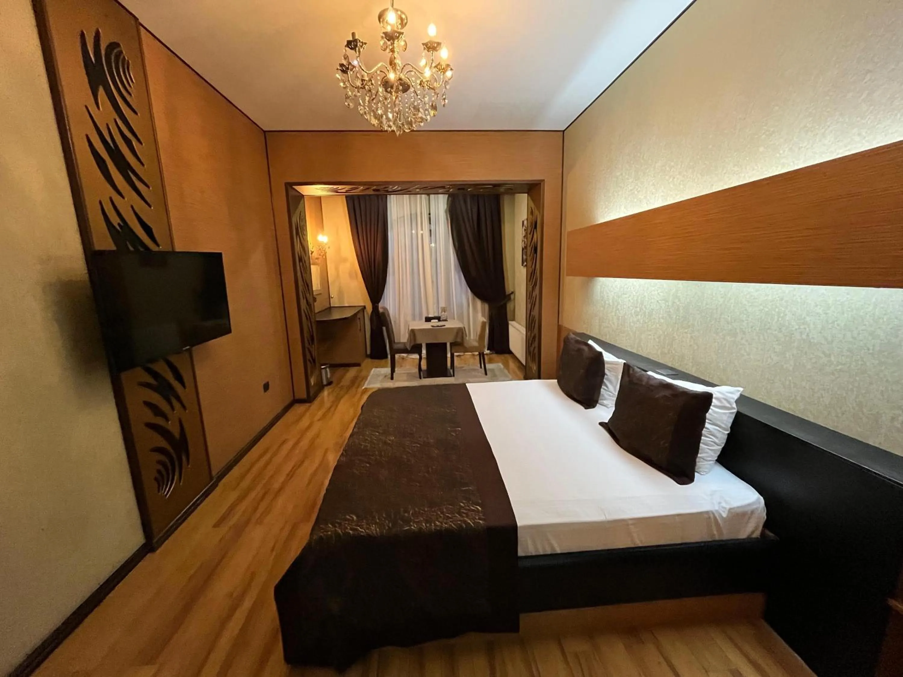 Communal lounge/ TV room, Bed in Bayil Breeze Hotel & Restaurant