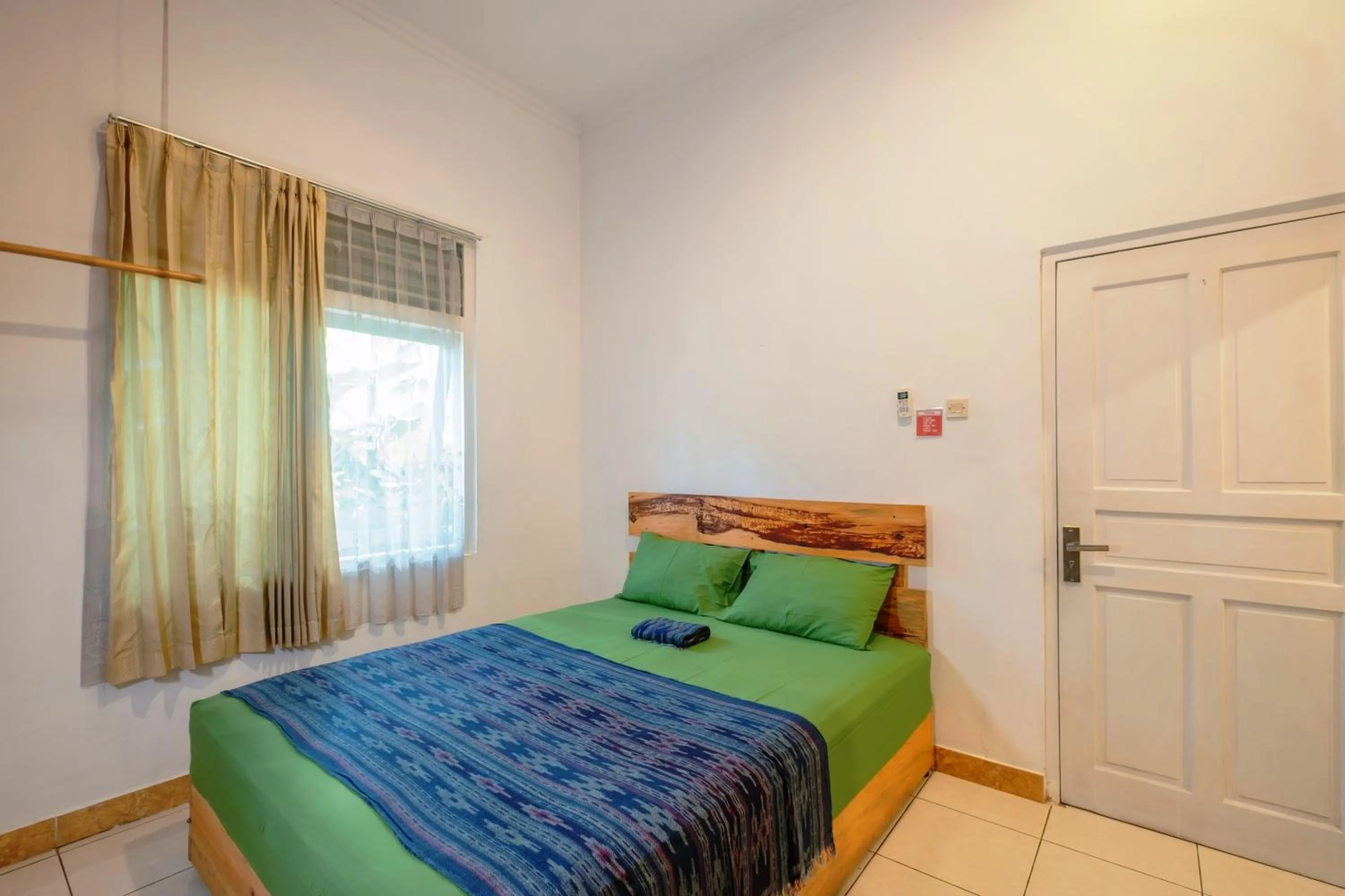 air conditioner, Bed in Happy Buddha Yogyakarta