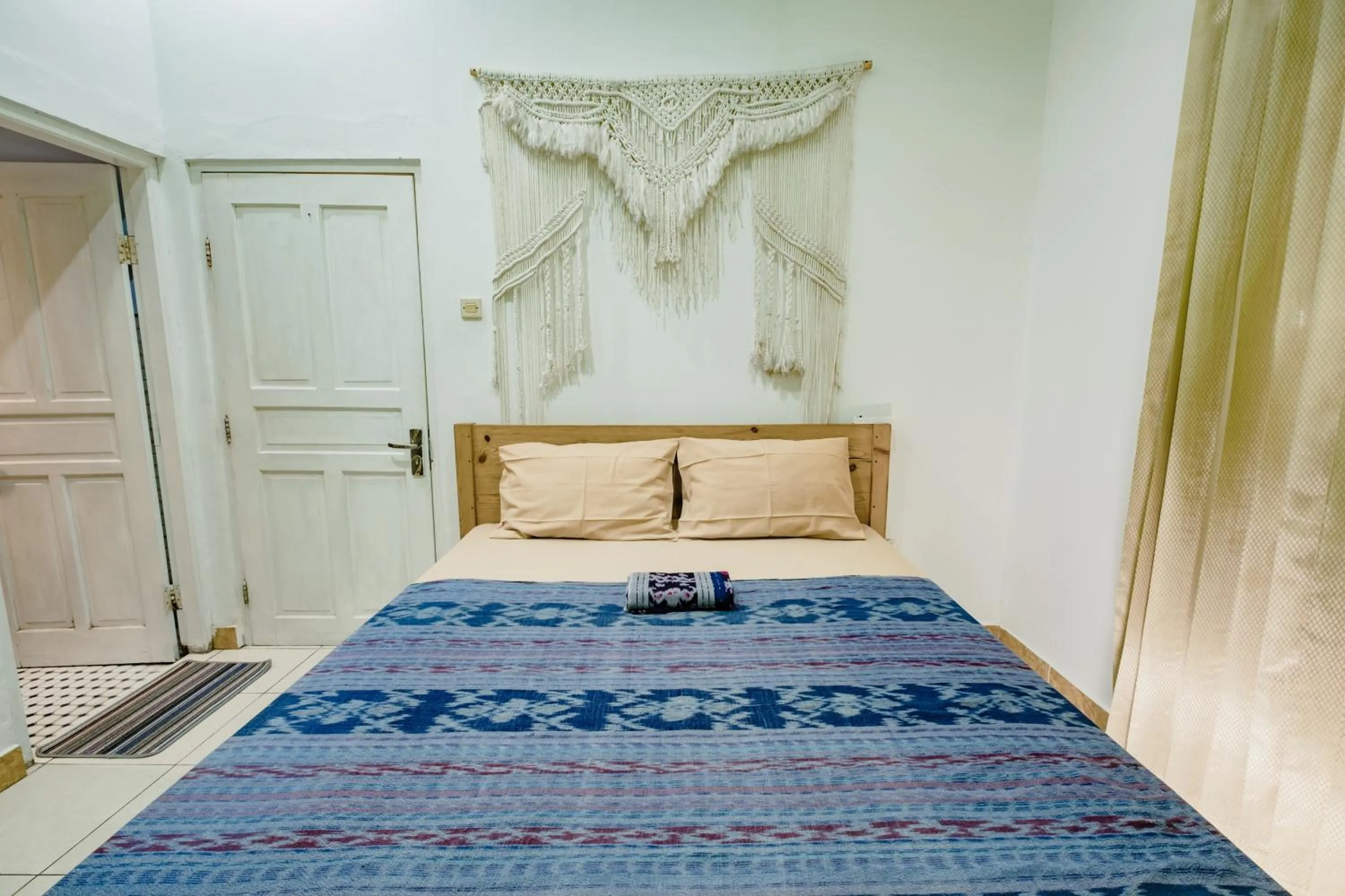 air conditioner, Bed in Happy Buddha Yogyakarta