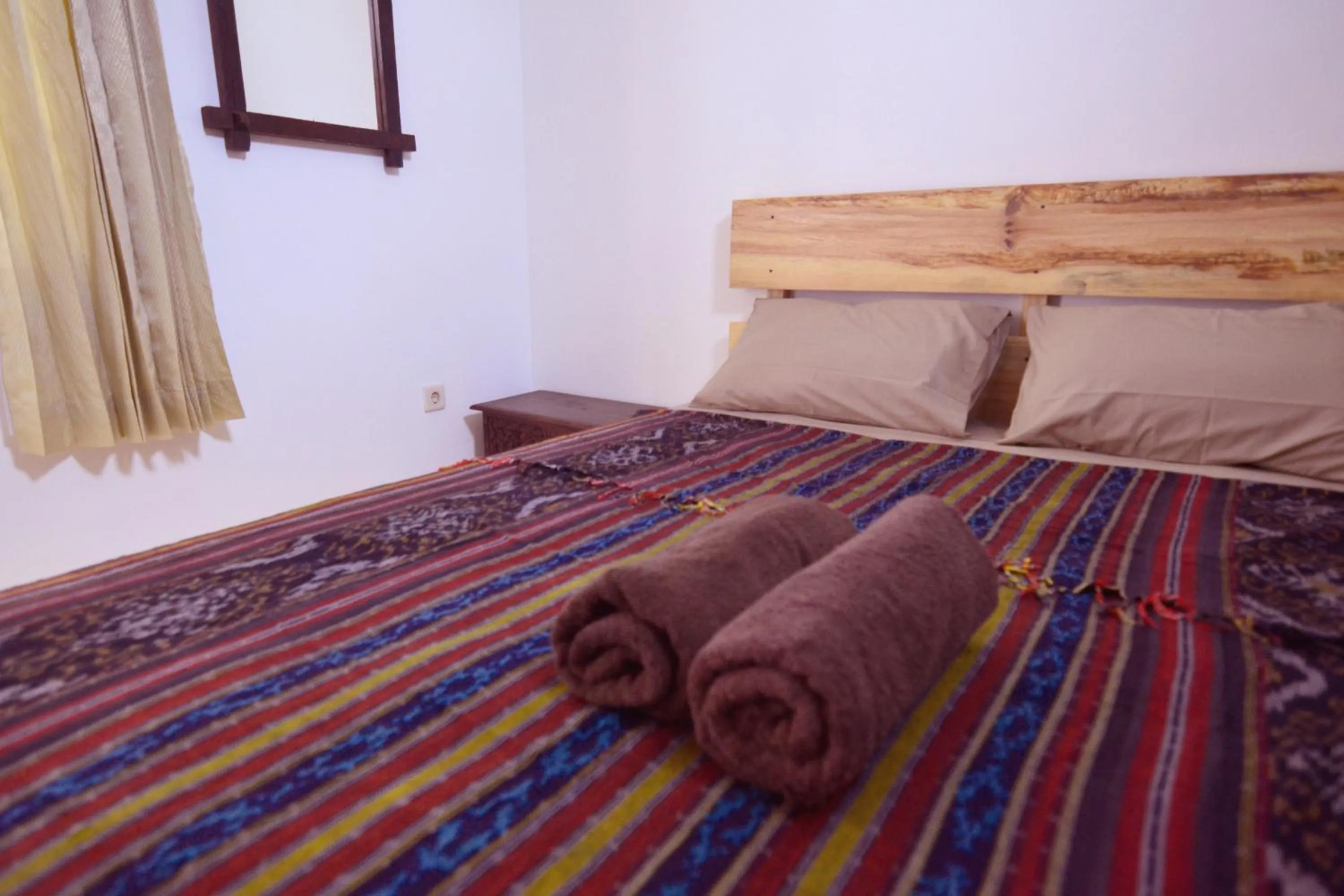 Bed in Happy Buddha Yogyakarta