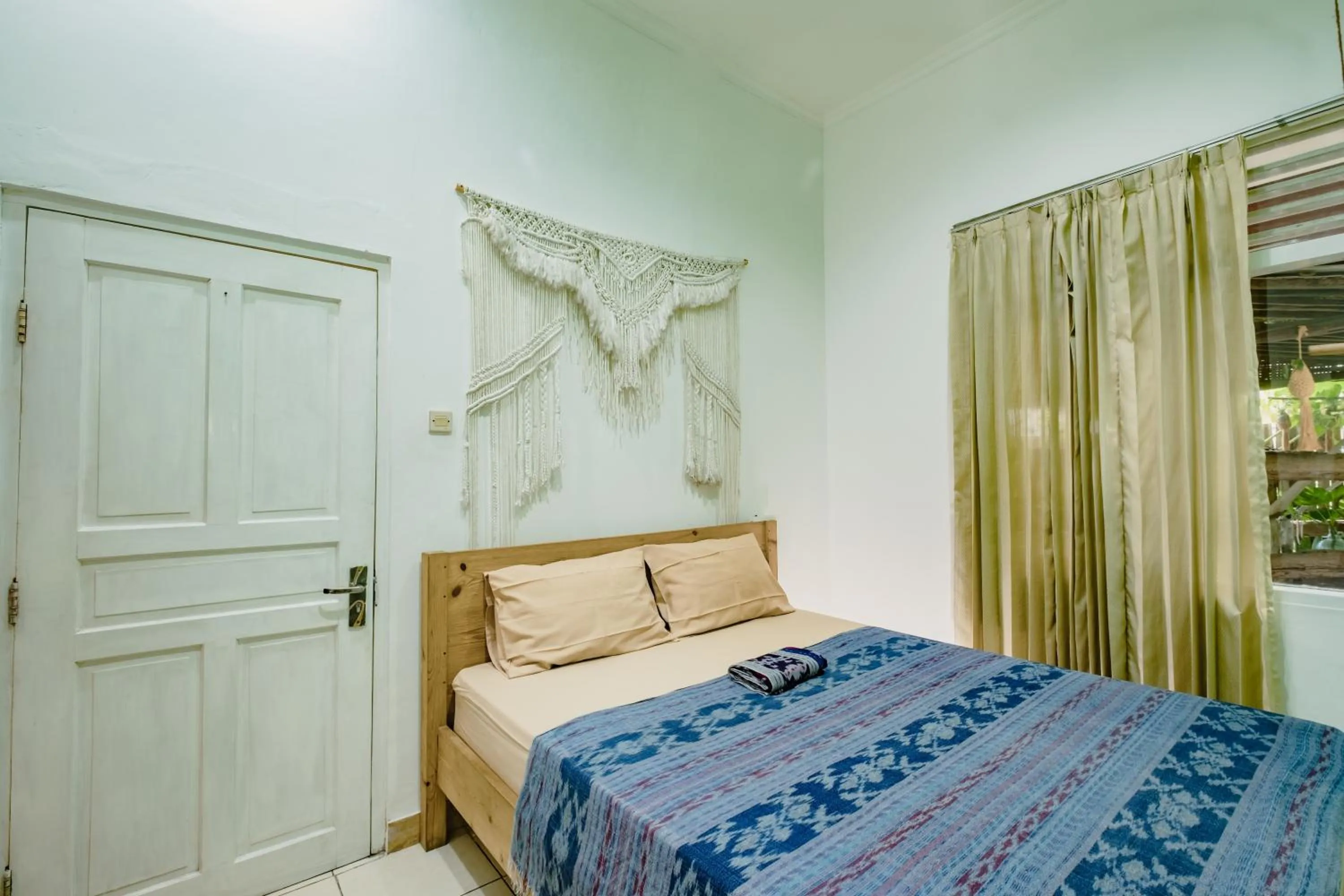 air conditioner, Bed in Happy Buddha Yogyakarta