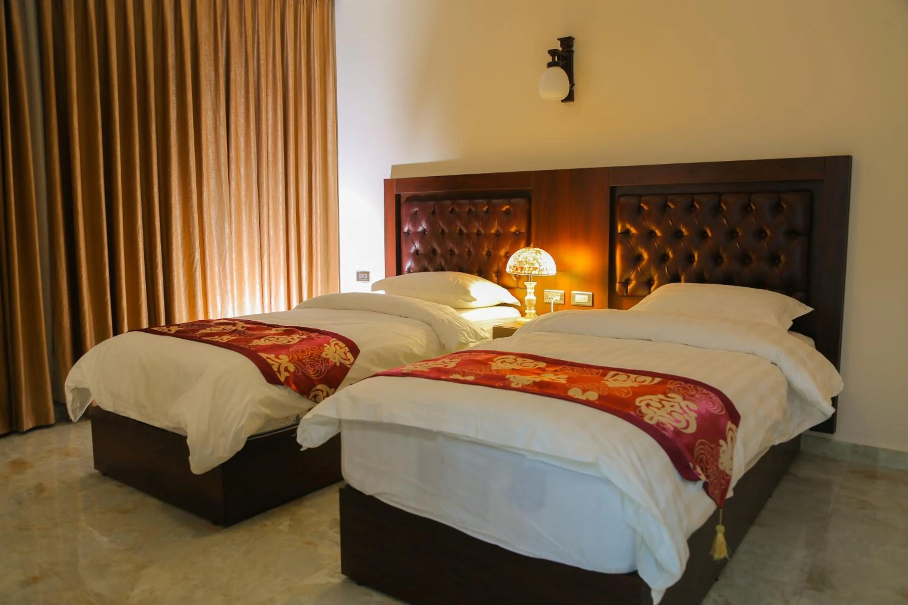 Bed in Qaser Al-Sultan Hotel Suites
