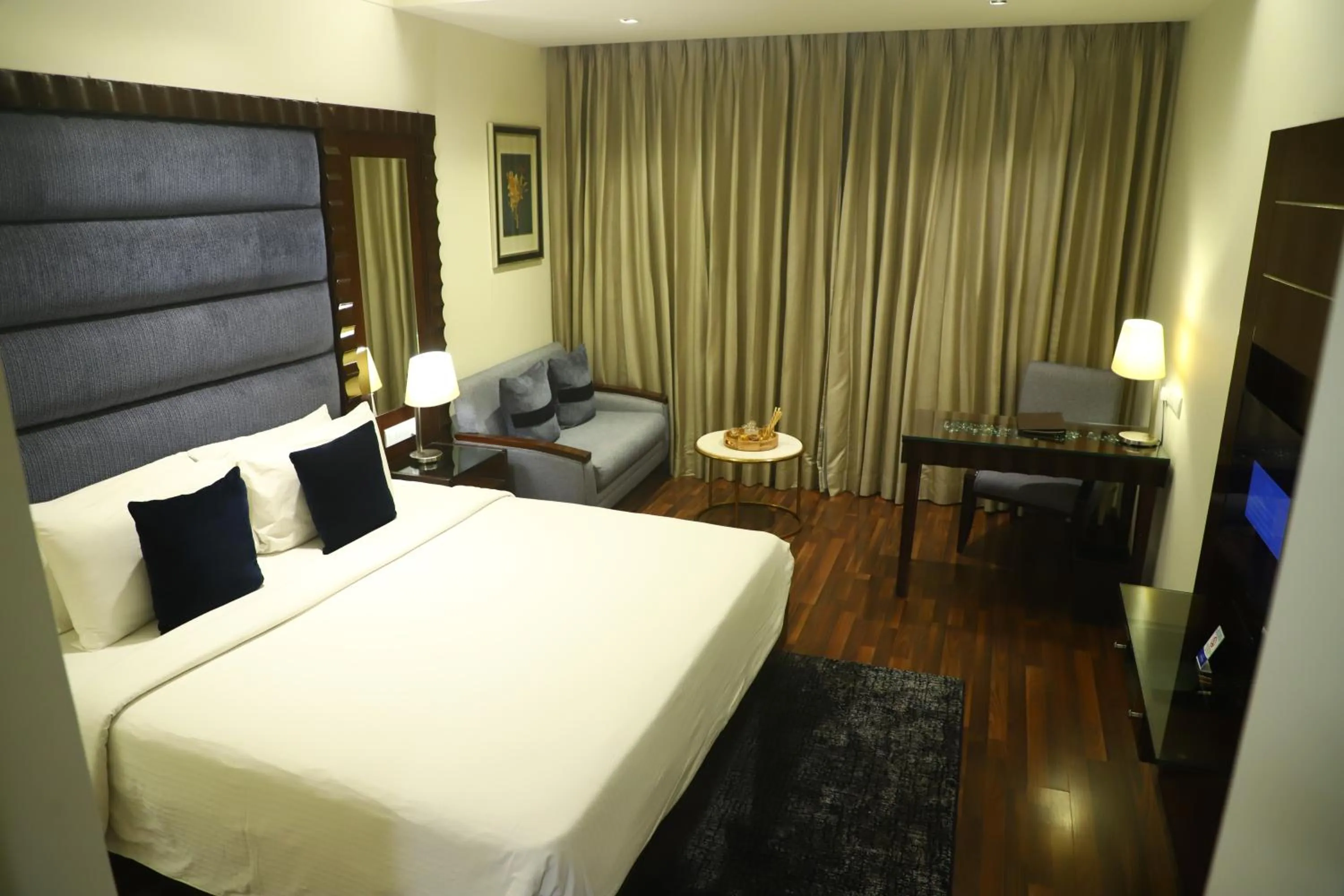 Bed in Deventure Sarovar Portico Kapashera, New Delhi