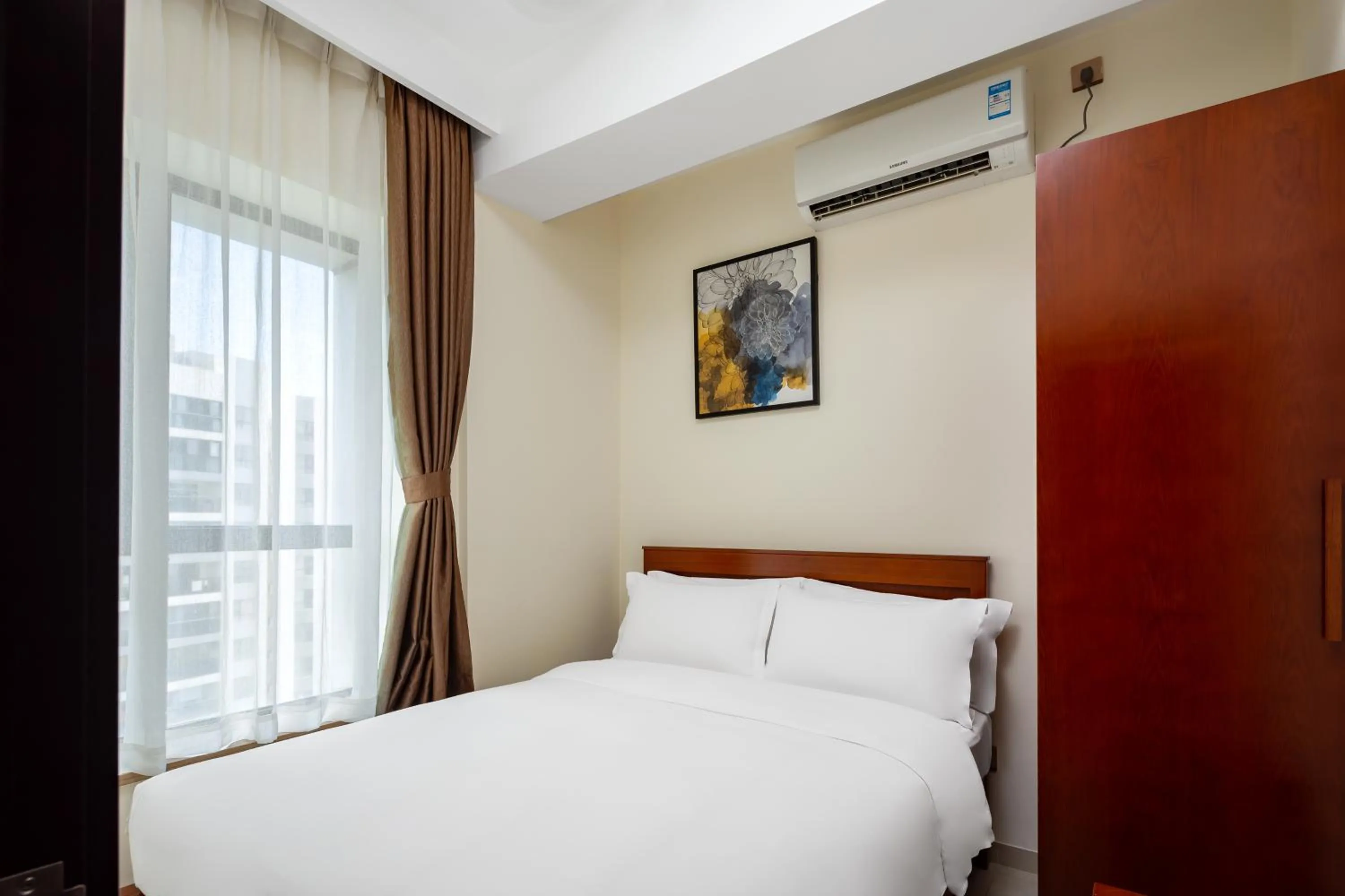 Bedroom in Paxton Vacances Hotel & Suite Sanya