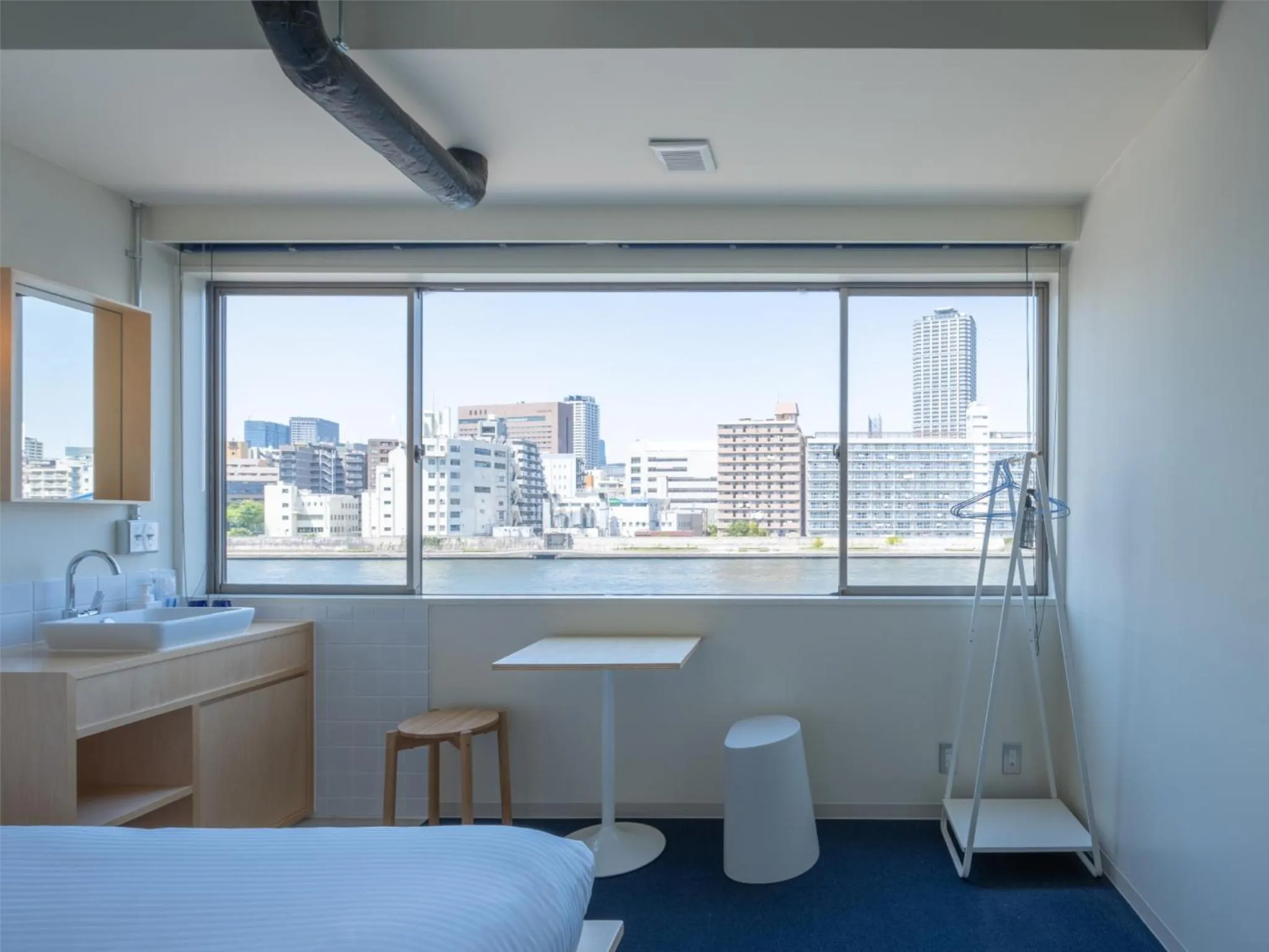 Photo of the whole room, Bed in LYURO Tokyo Kiyosumi by THE SHARE HOTELS