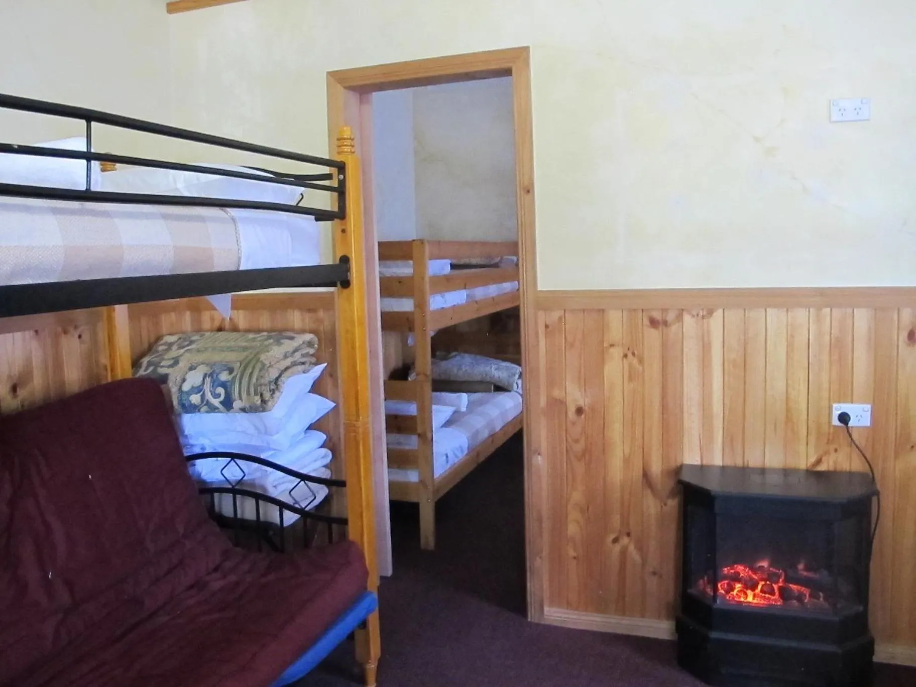 Bed in Cedar Lodge Cabins
