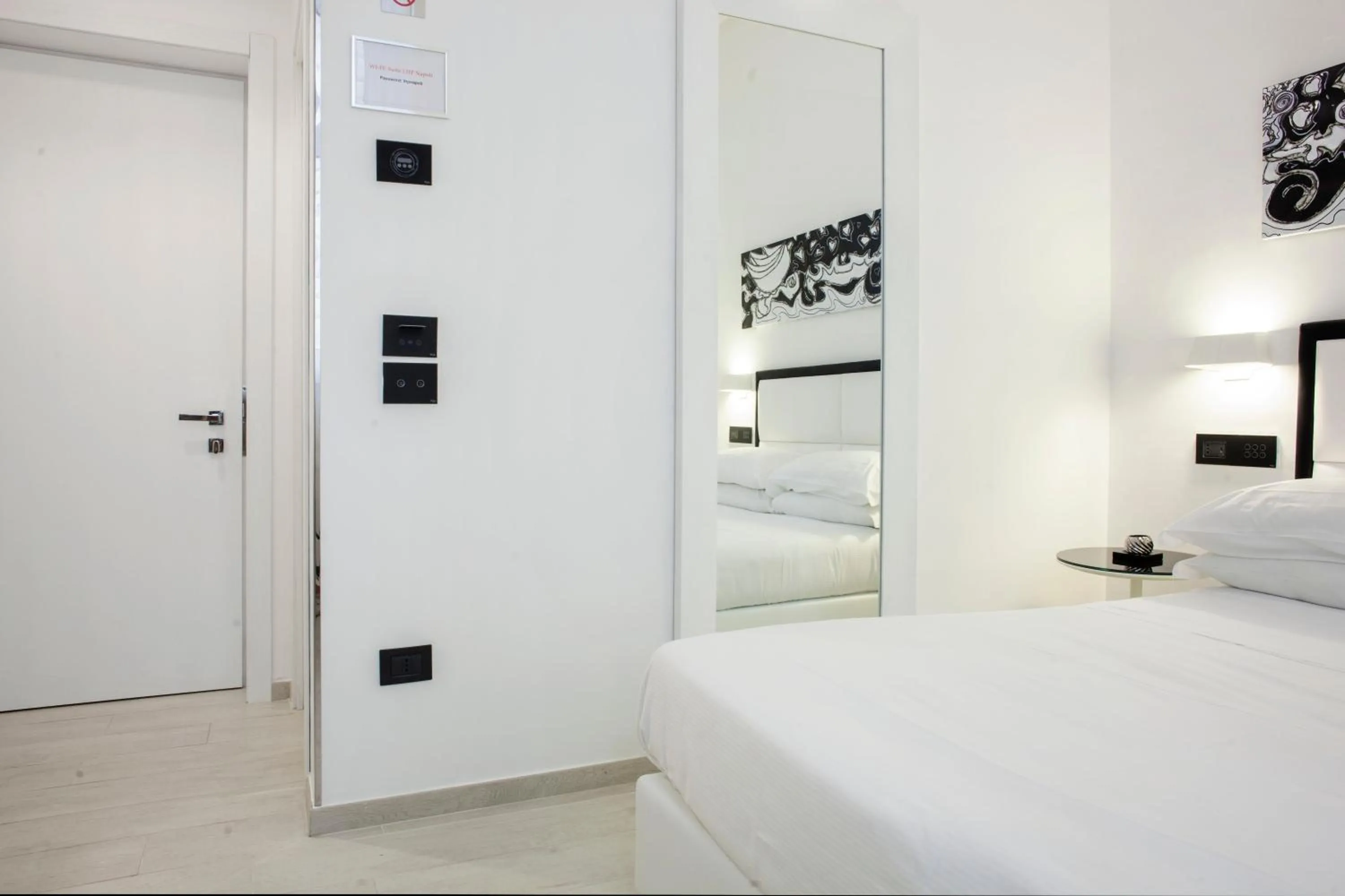 Photo of the whole room, Bed in LHP Suite Napoli Parco Margherita