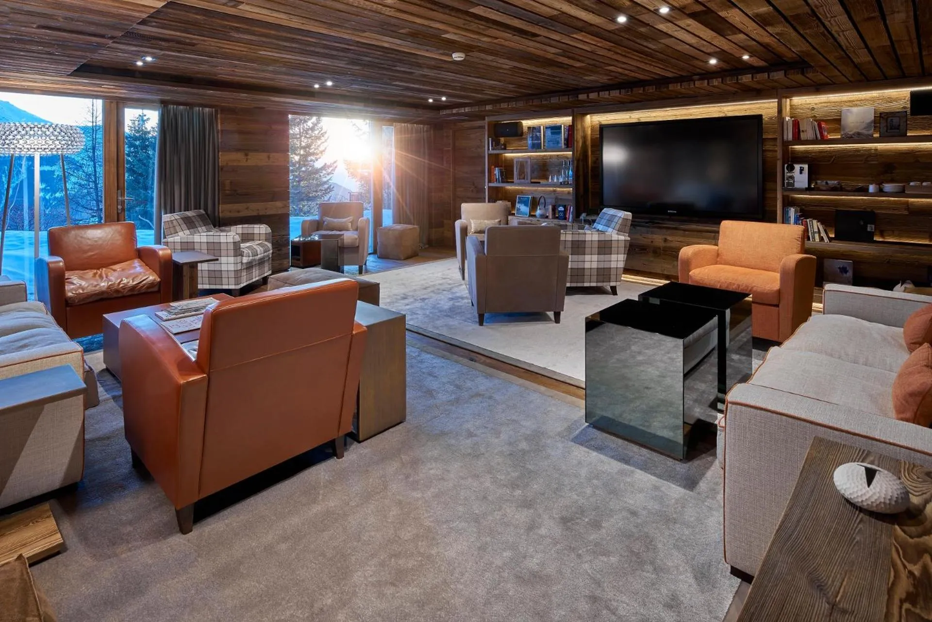 Communal lounge/ TV room in Chandolin Boutique Hotel