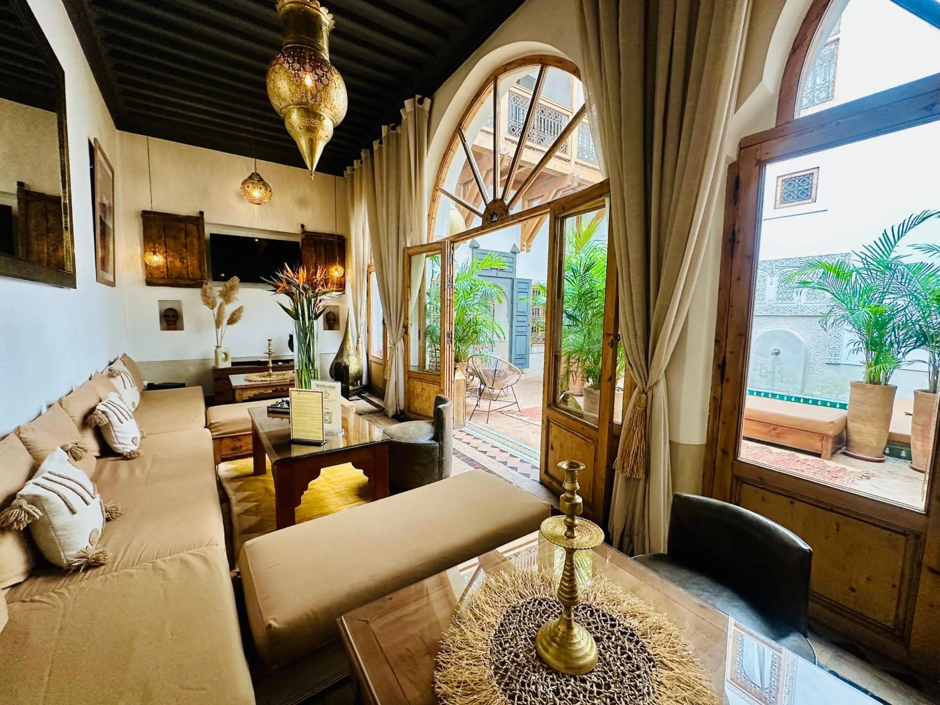 Communal lounge/ TV room in Riad Jardin Des Sens & Spa