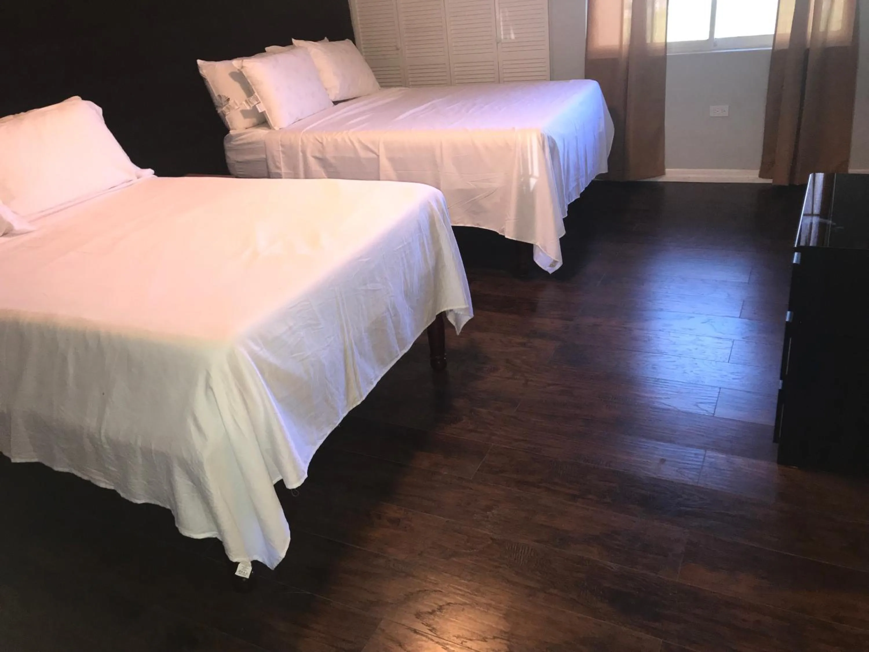 Bed in Abacus Jamaica the Zana Suites