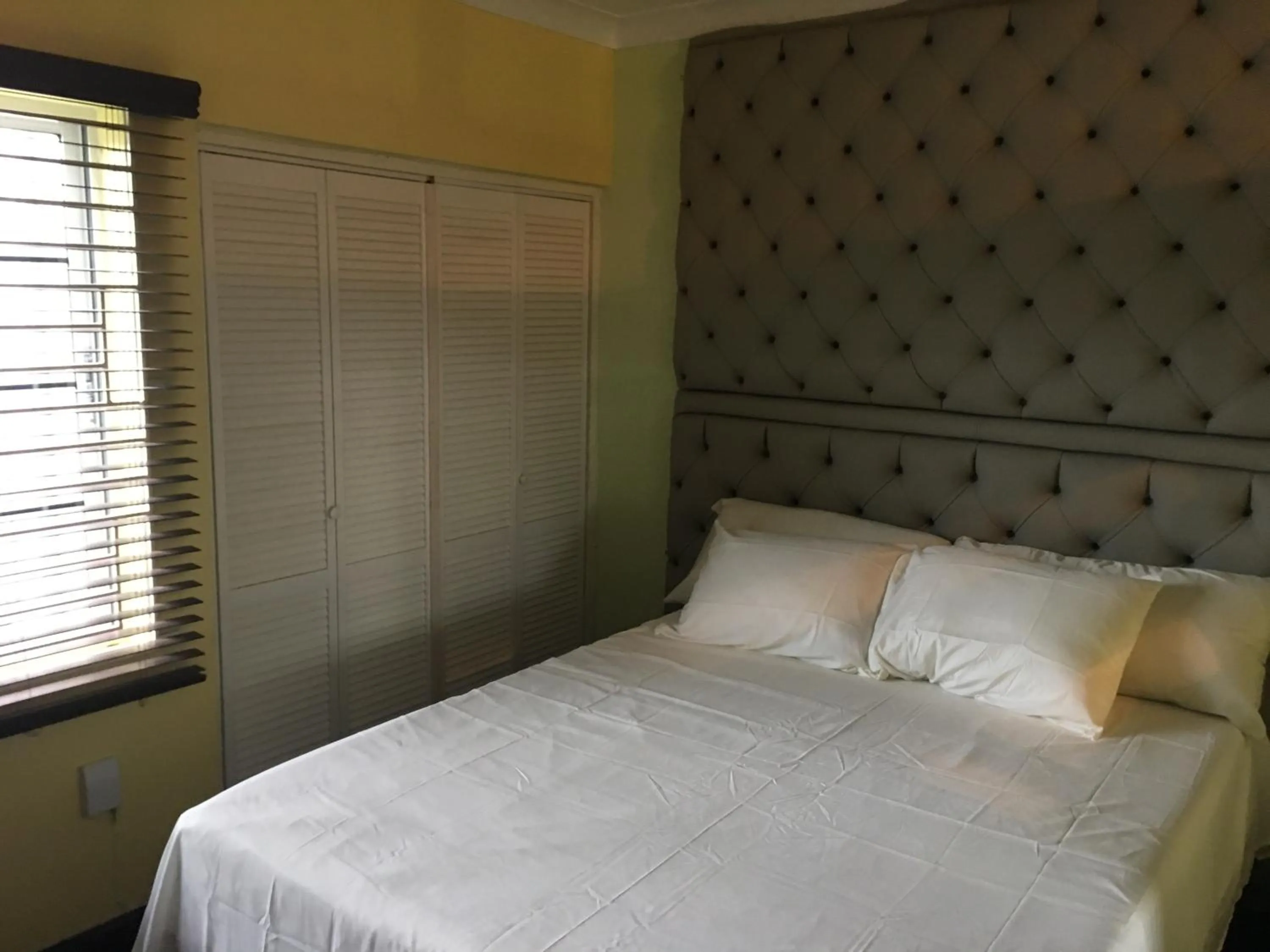 Bed in Abacus Jamaica the Zana Suites