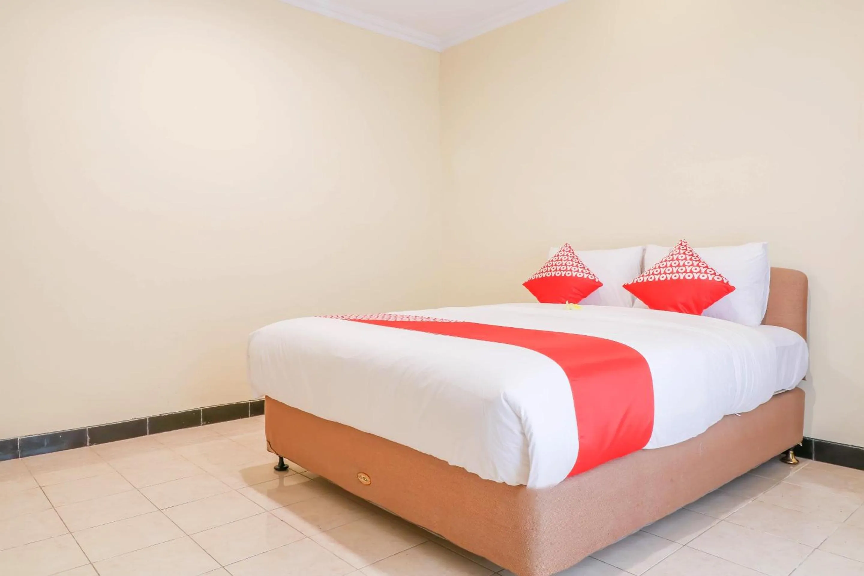 Bedroom in Super OYO 1654 Maha Bharata Kuta Inn