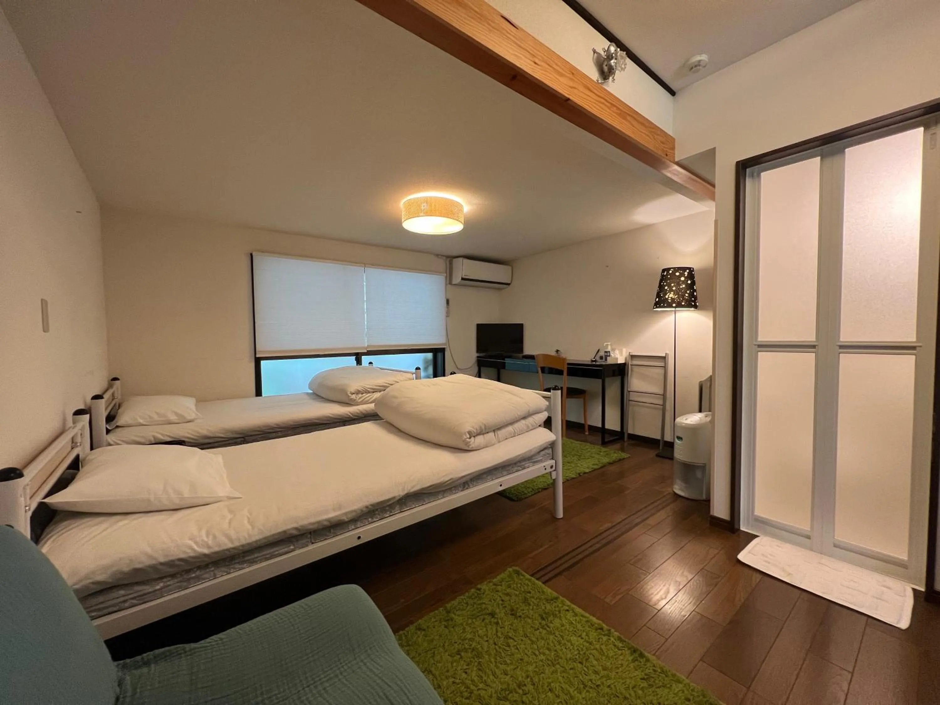 Bed in Bamboo Village Guest House