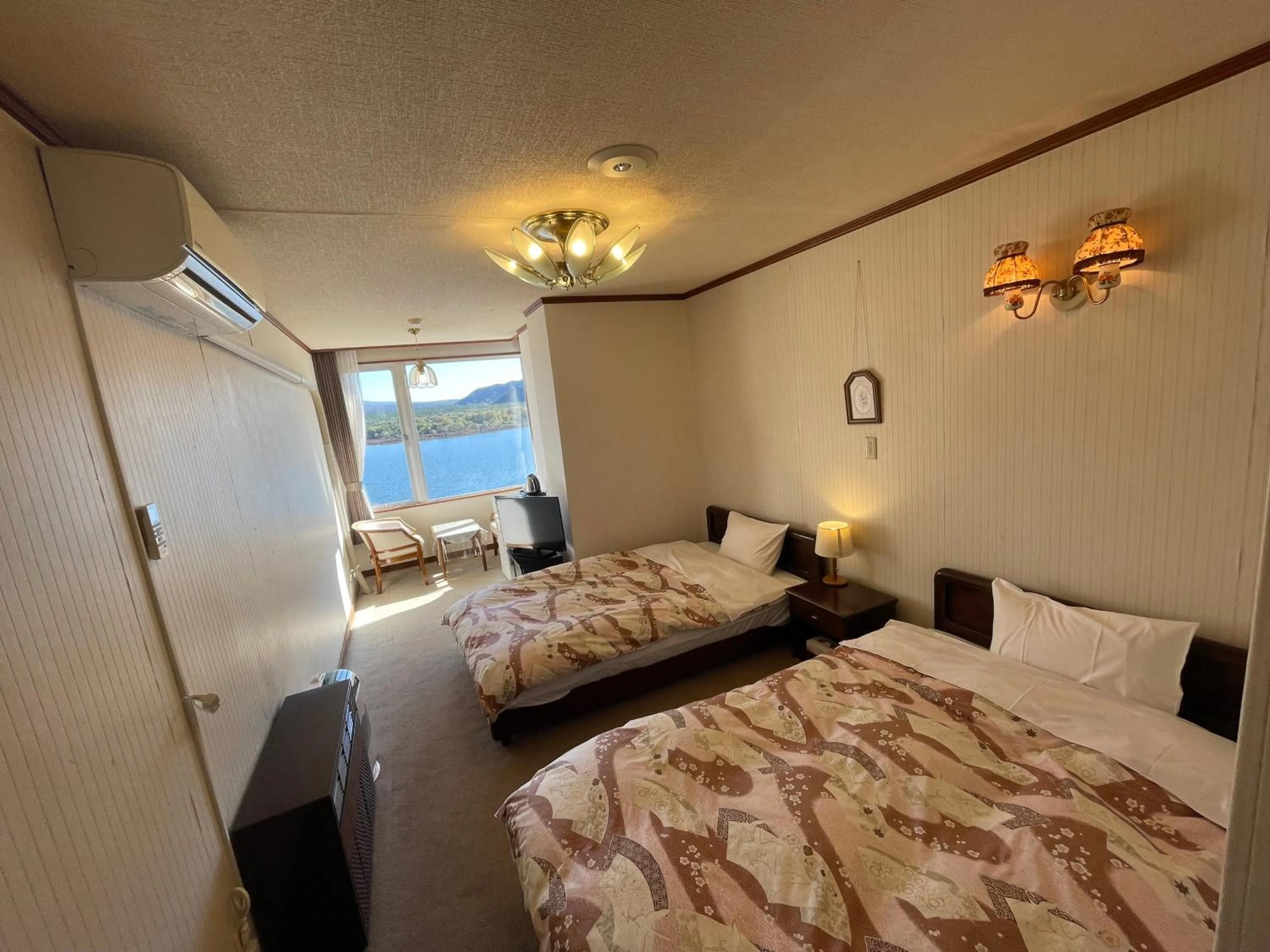 Bed in Shoji Lake Hotel