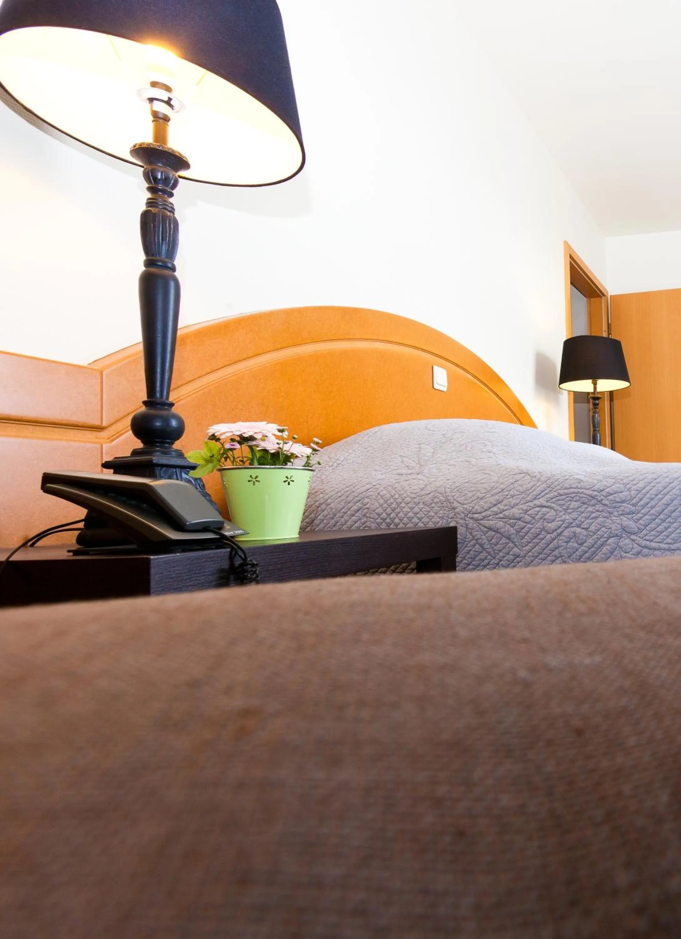 Bed in Aparthotel Le Manoir du Capitaine