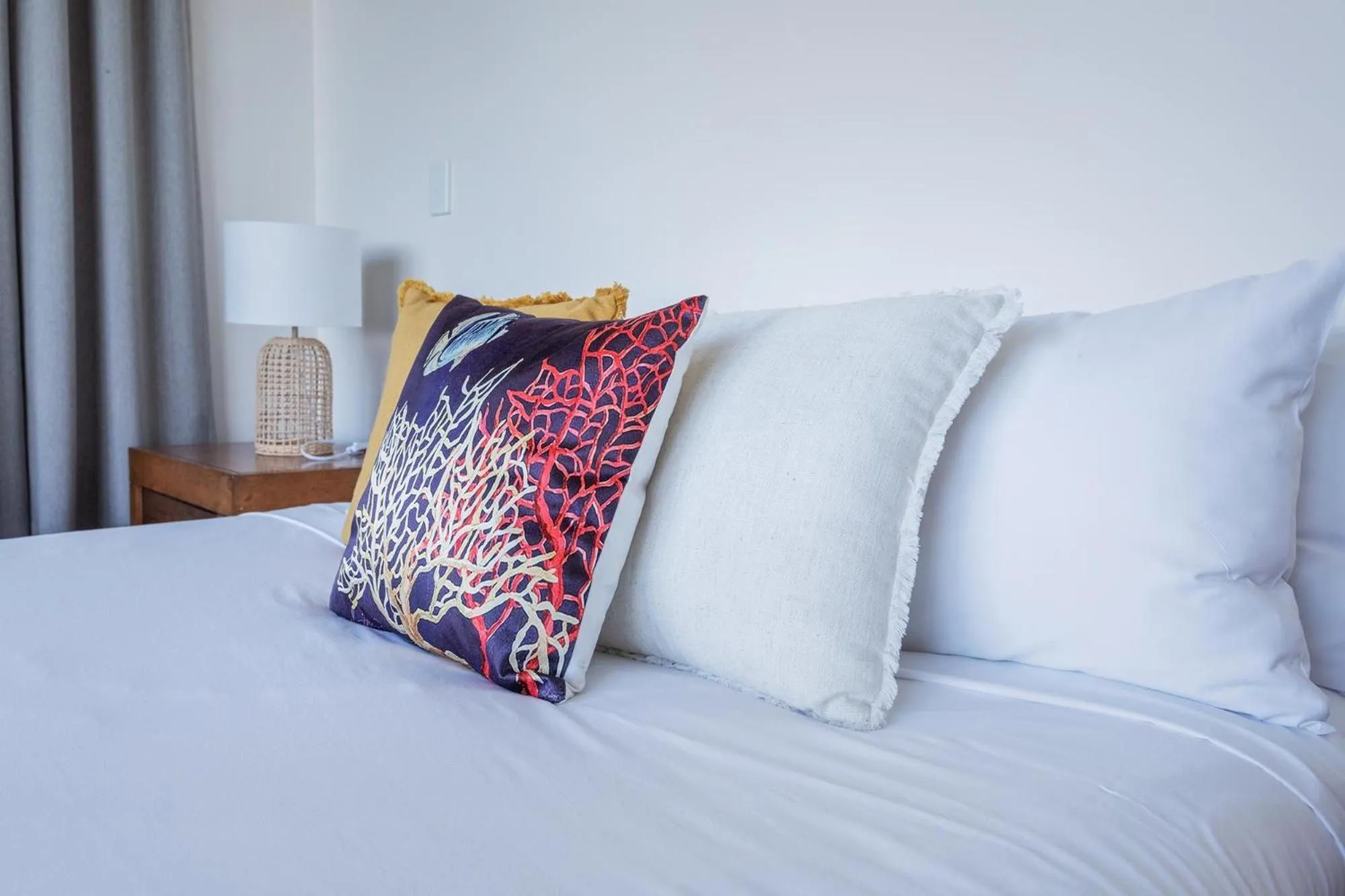 Bed in Coral Cove Apartments - Absolute Beachfront Resort Bowen