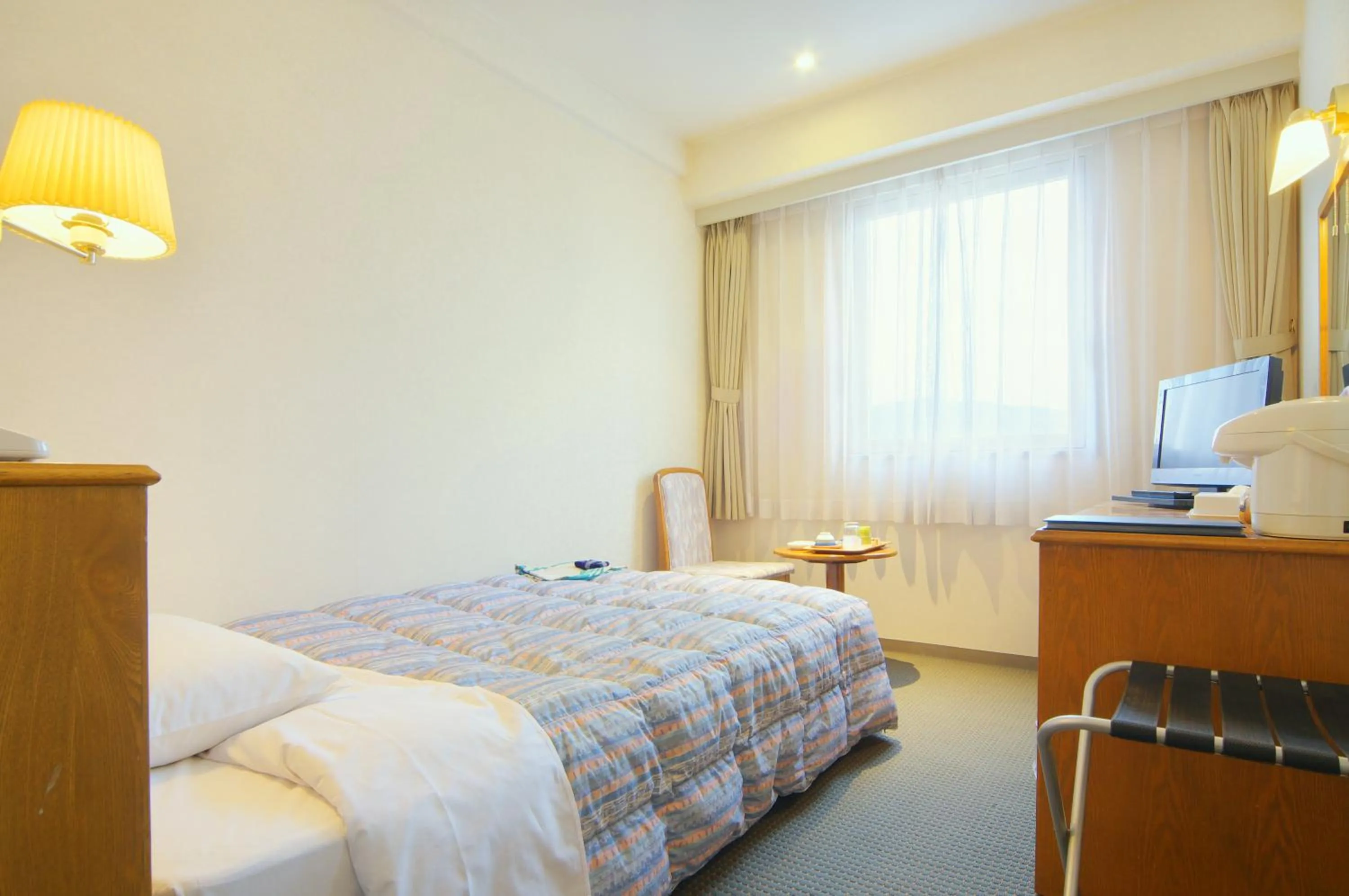 Bed in New Royal Hotel Shimanto