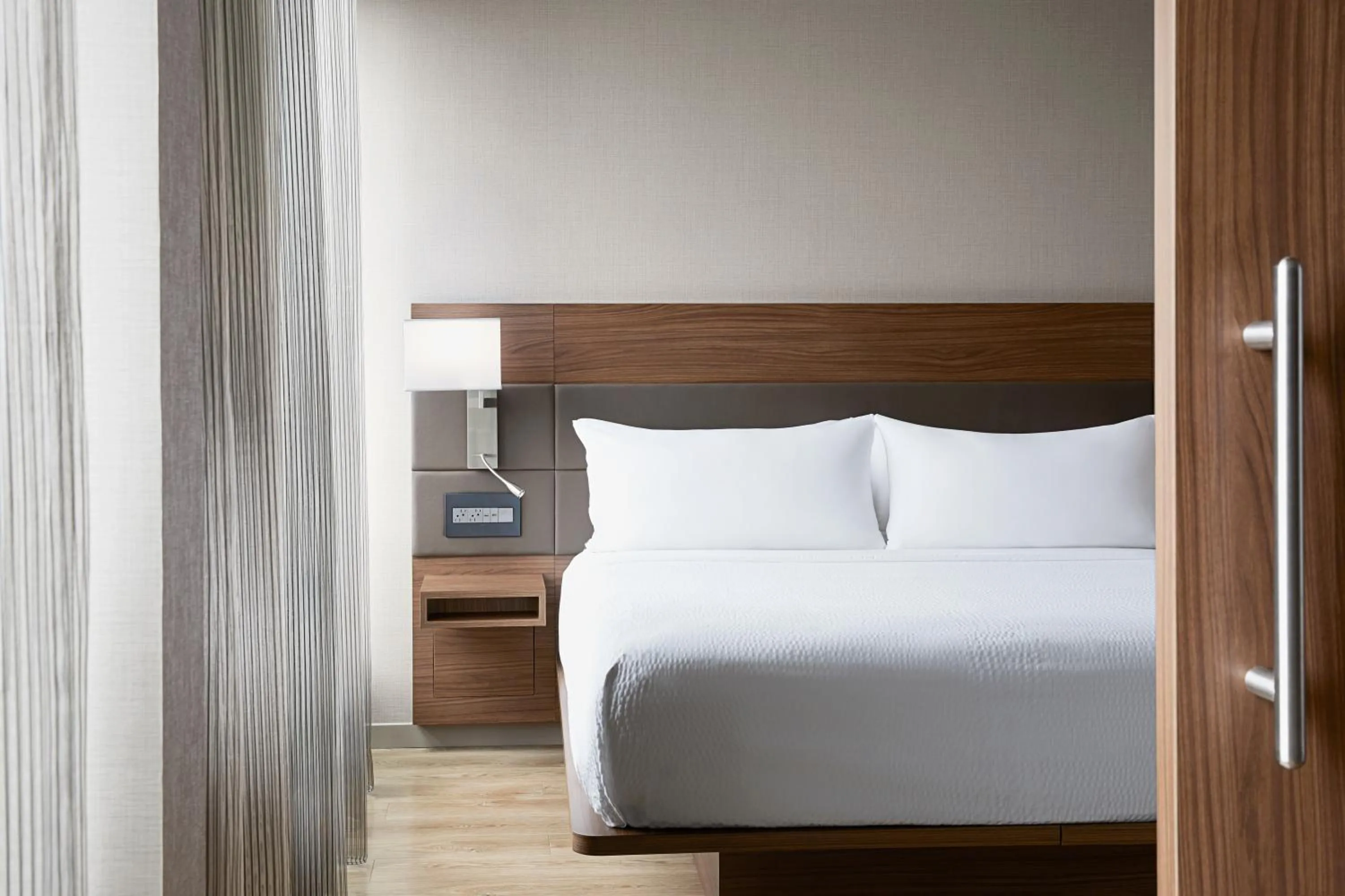 Bed in AC Hotel by Marriott Bloomington Mall of America