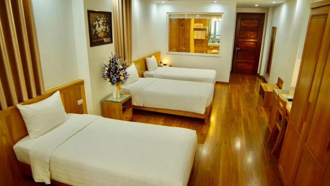 Bed in Blue Hanoi Hotel