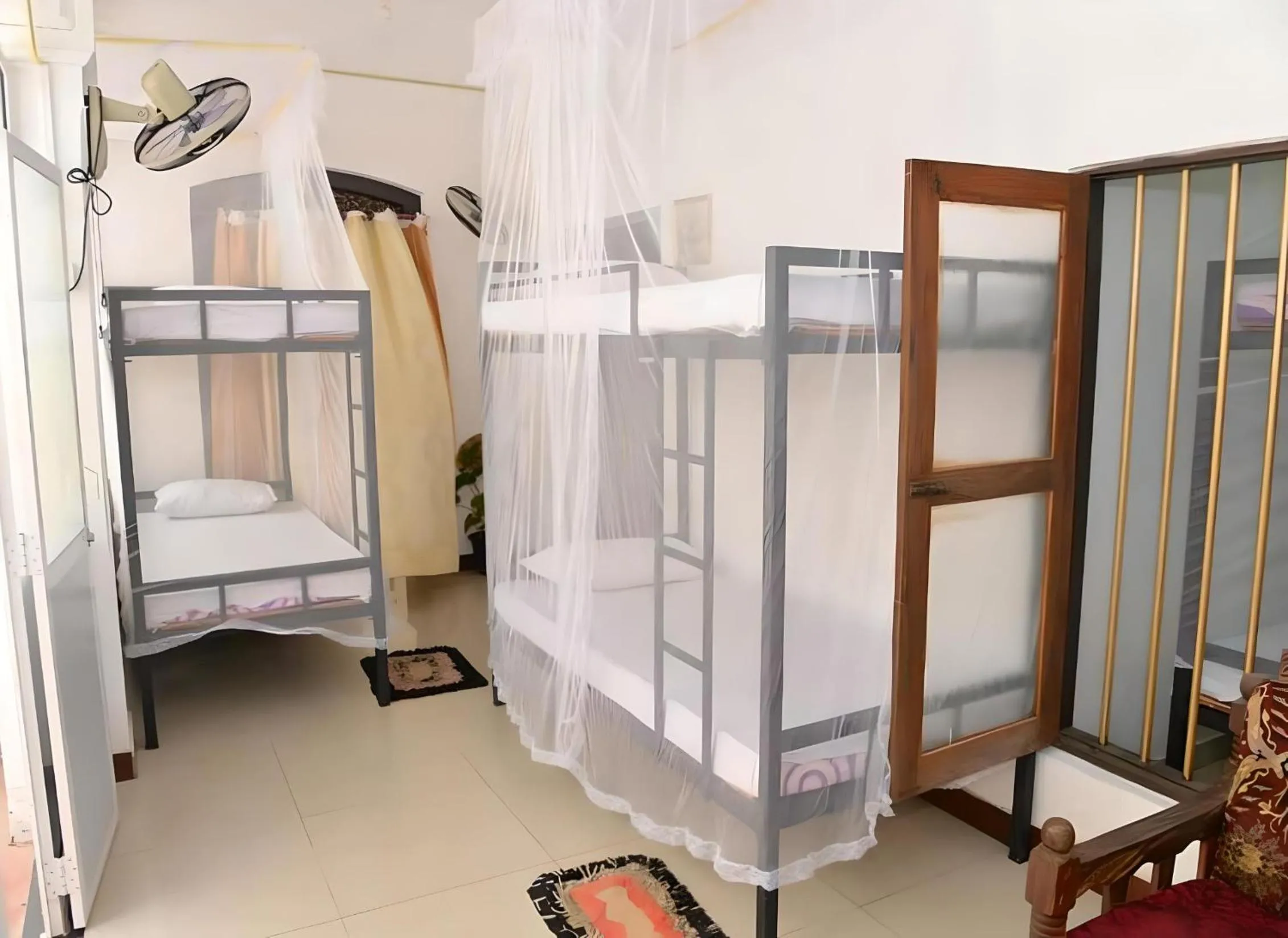 Photo of the whole room, Bed in Traveller's Hostel Hikkaduwa