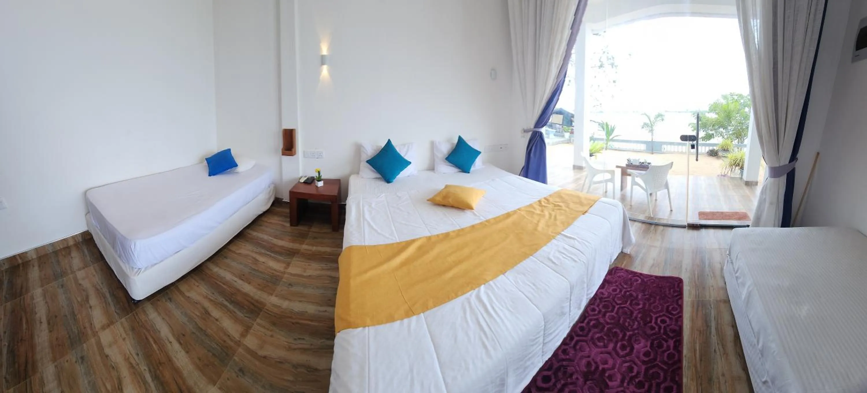 Bed in Dinuda Lagoon Hotel
