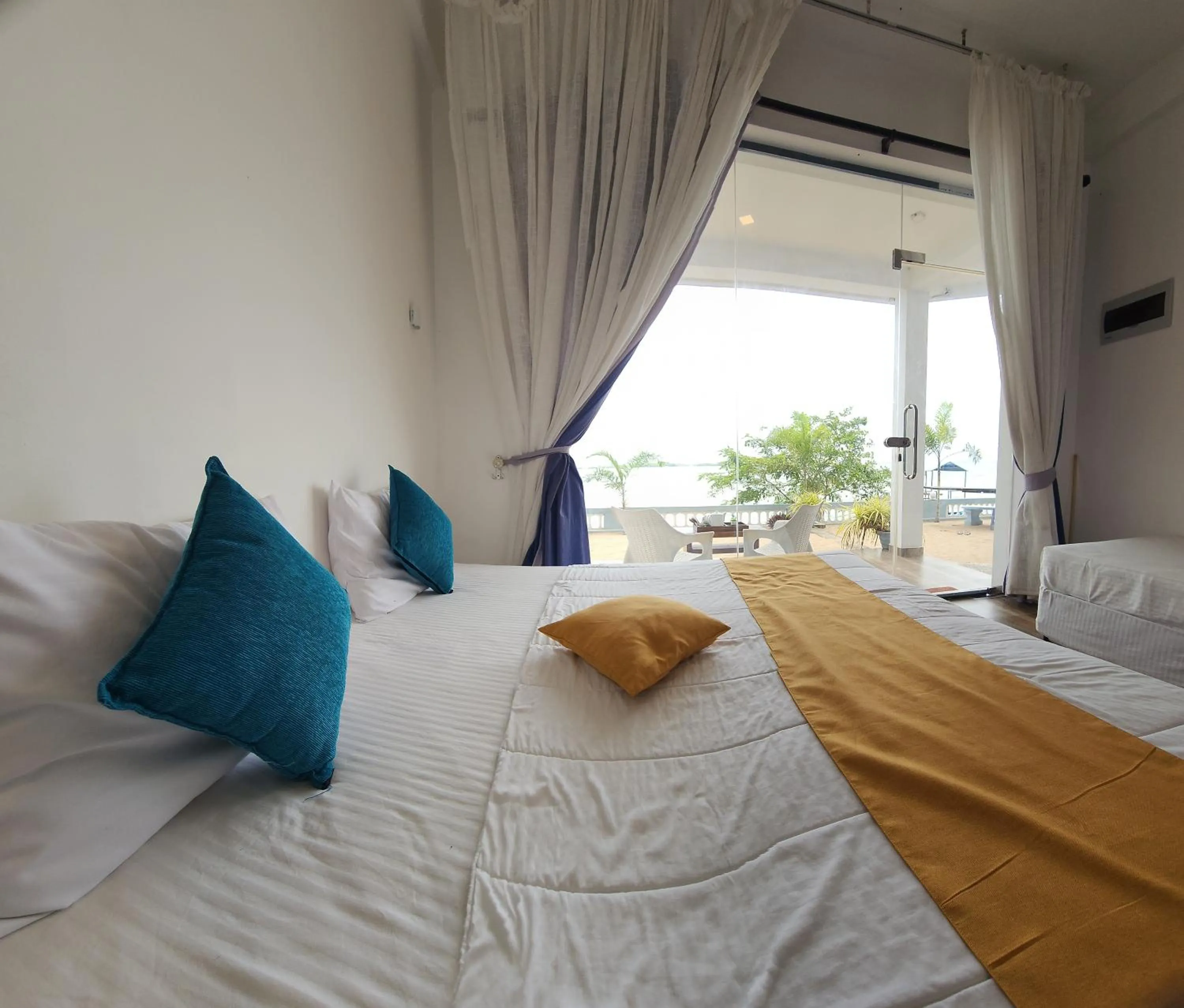 Bed in Dinuda Lagoon Hotel