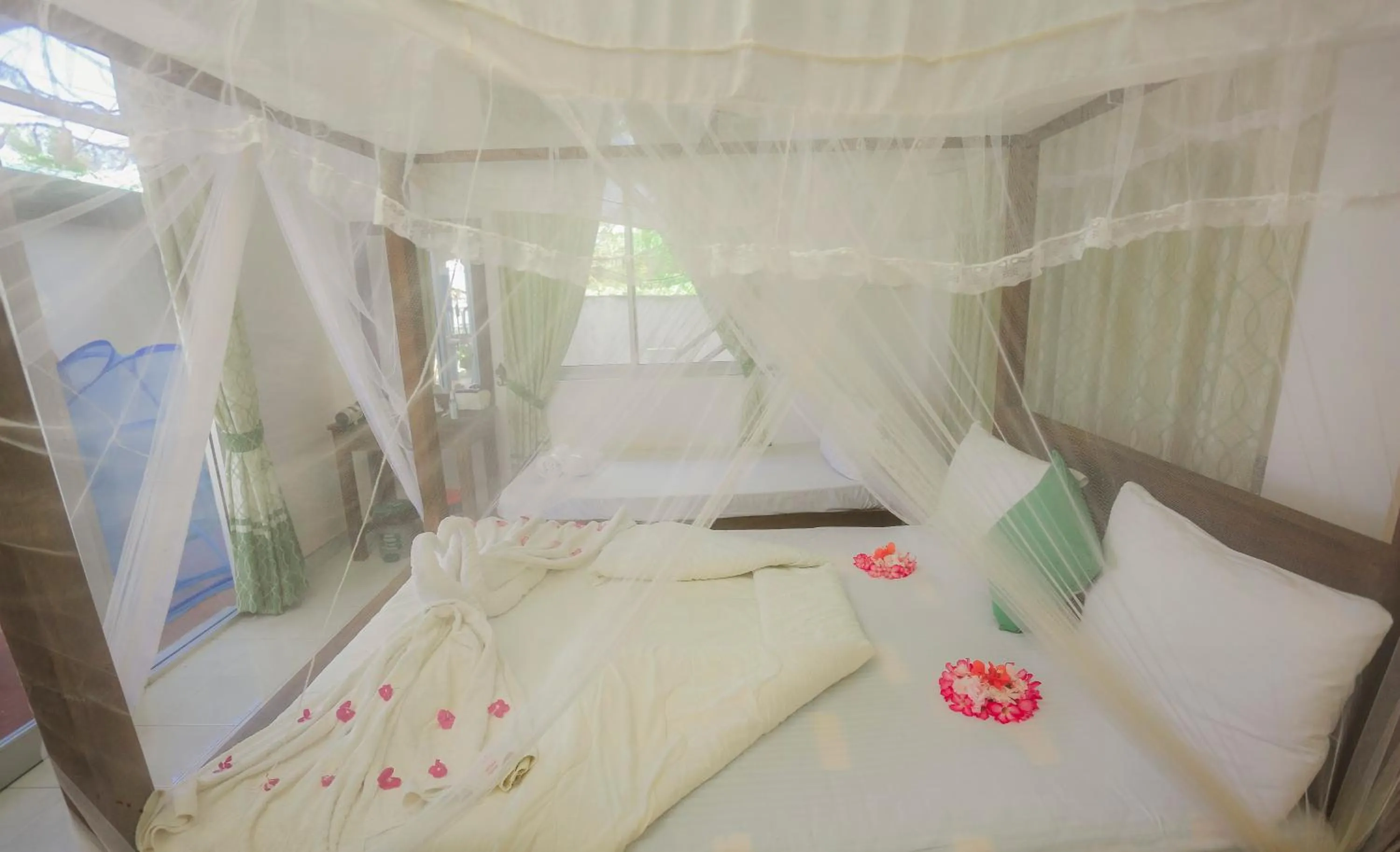 Bed in Dinuda Lagoon Hotel