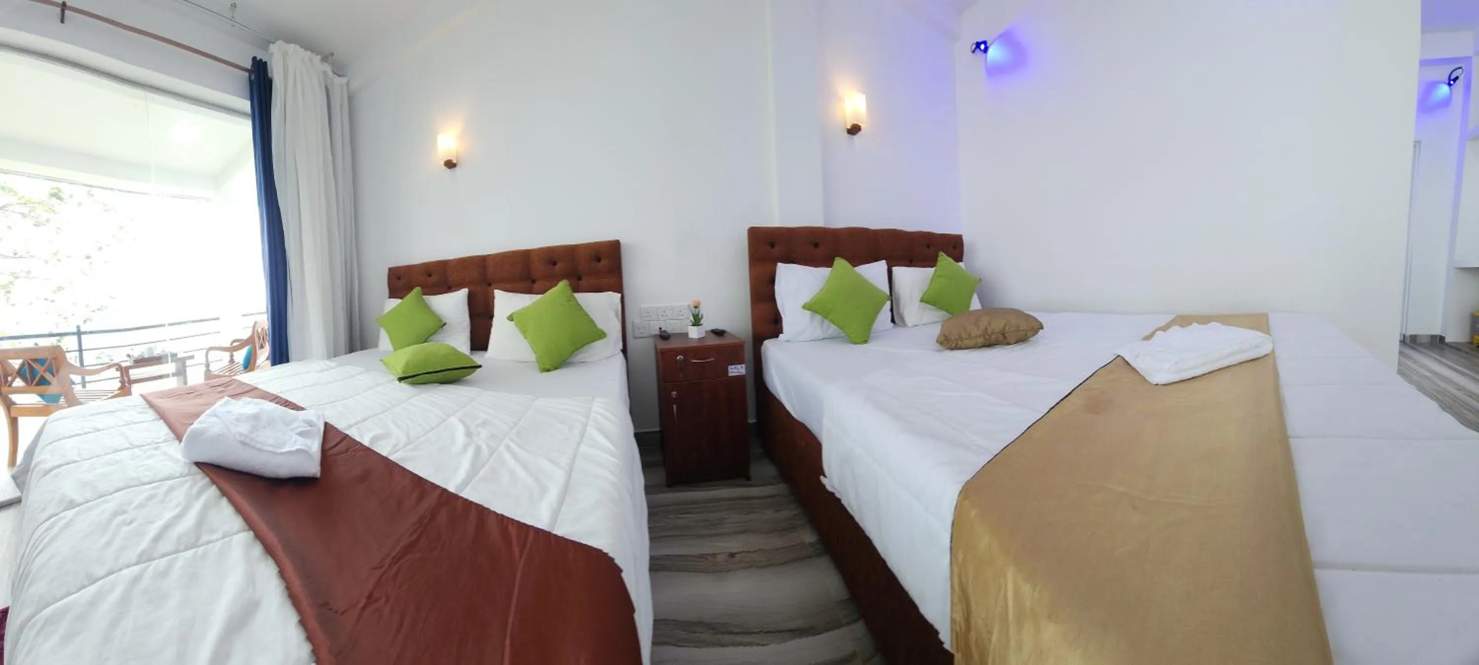 Bed in Dinuda Lagoon Hotel