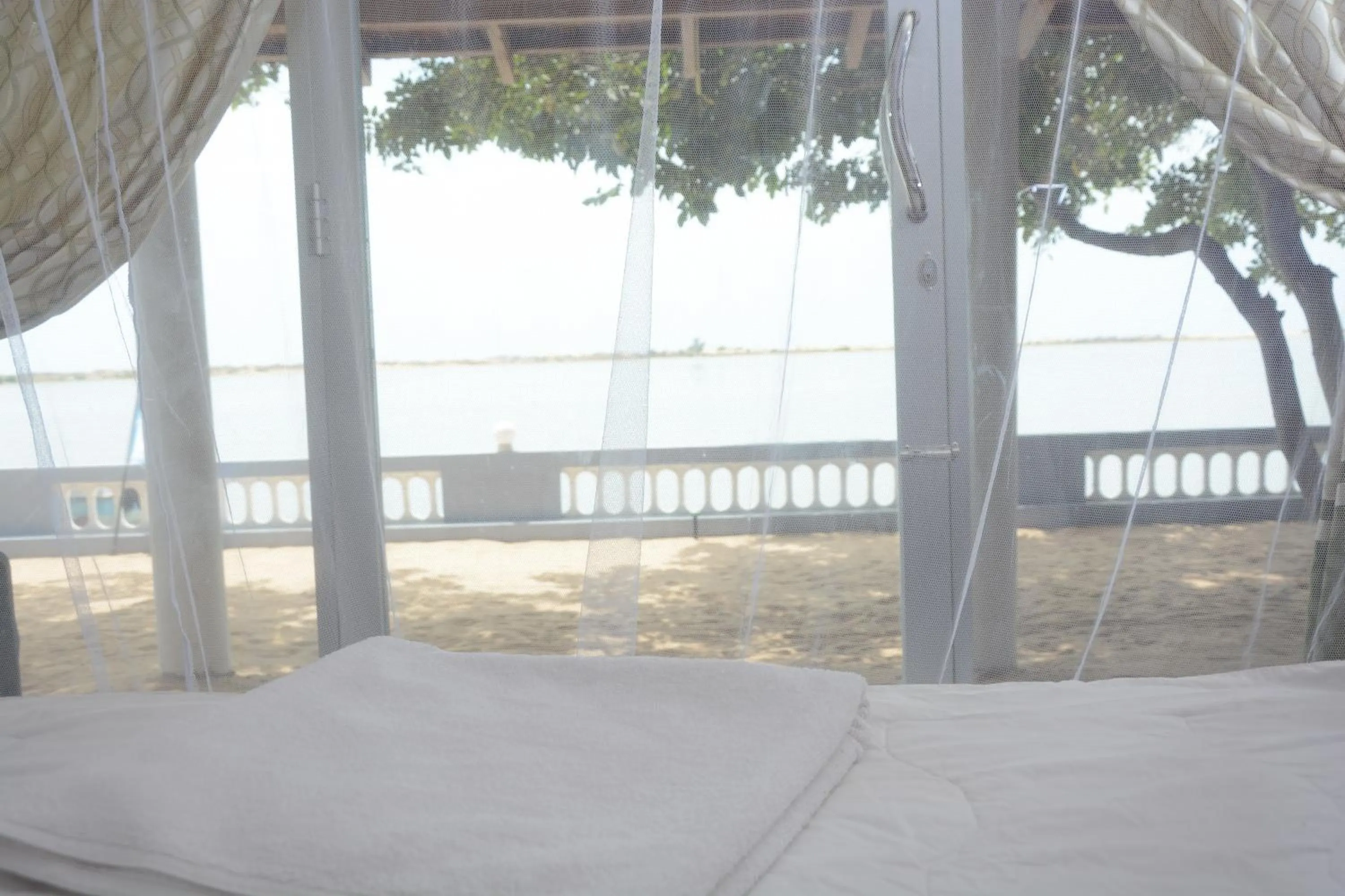 Bed in Dinuda Lagoon Hotel