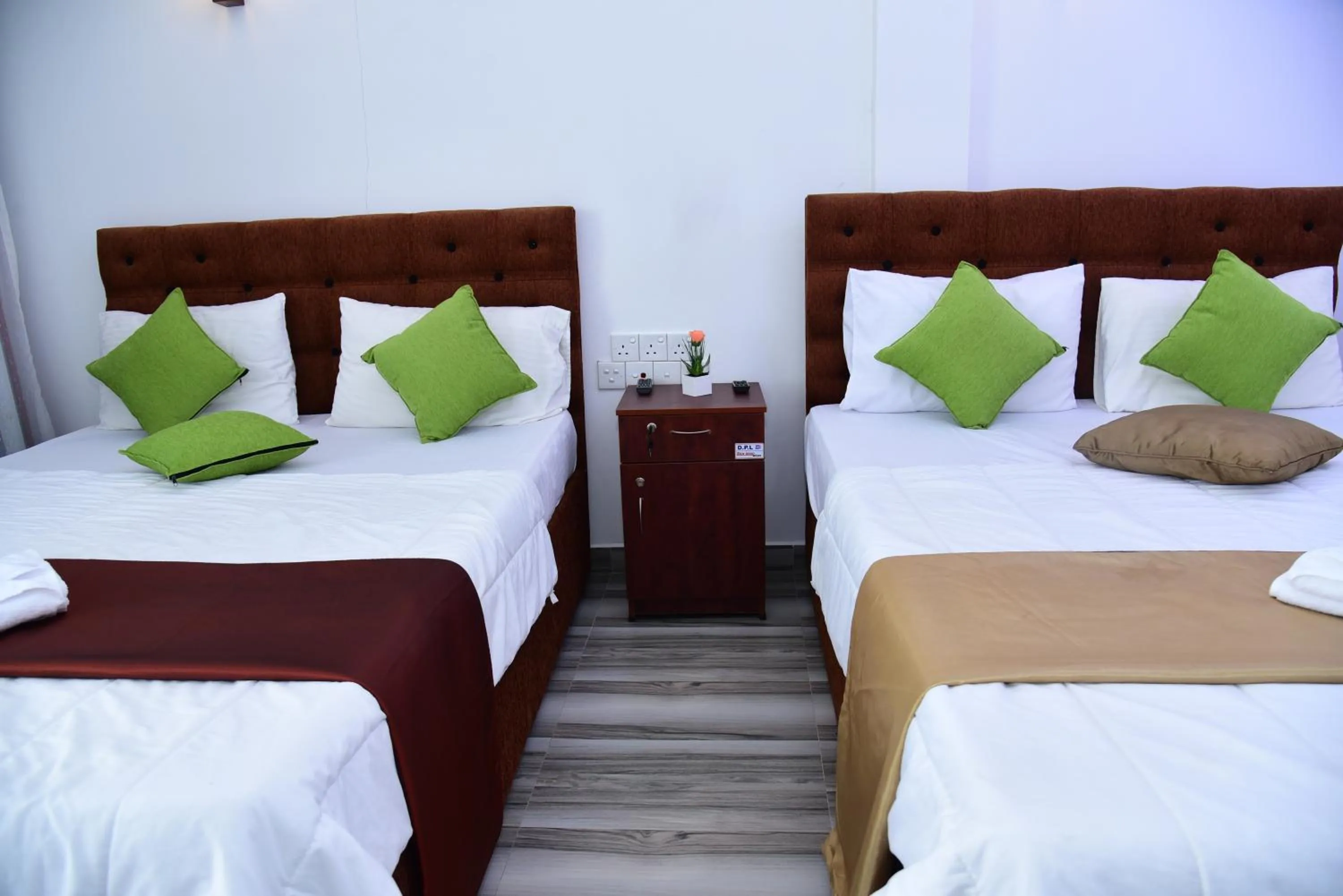 Bed in Dinuda Lagoon Hotel