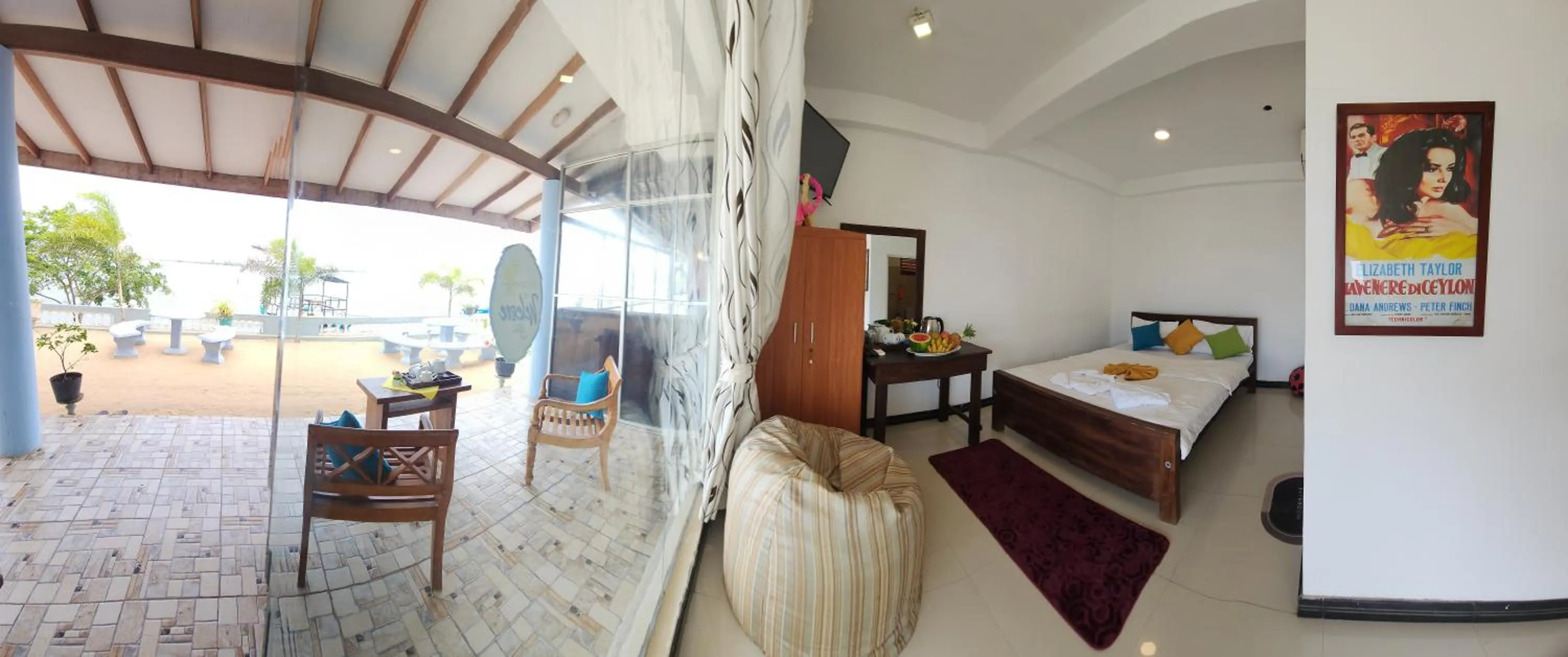 Bed in Dinuda Lagoon Hotel