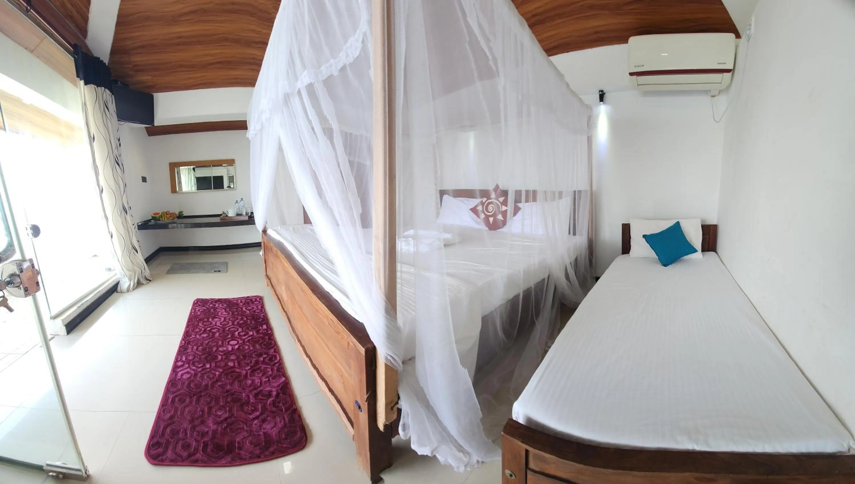 Bed in Dinuda Lagoon Hotel