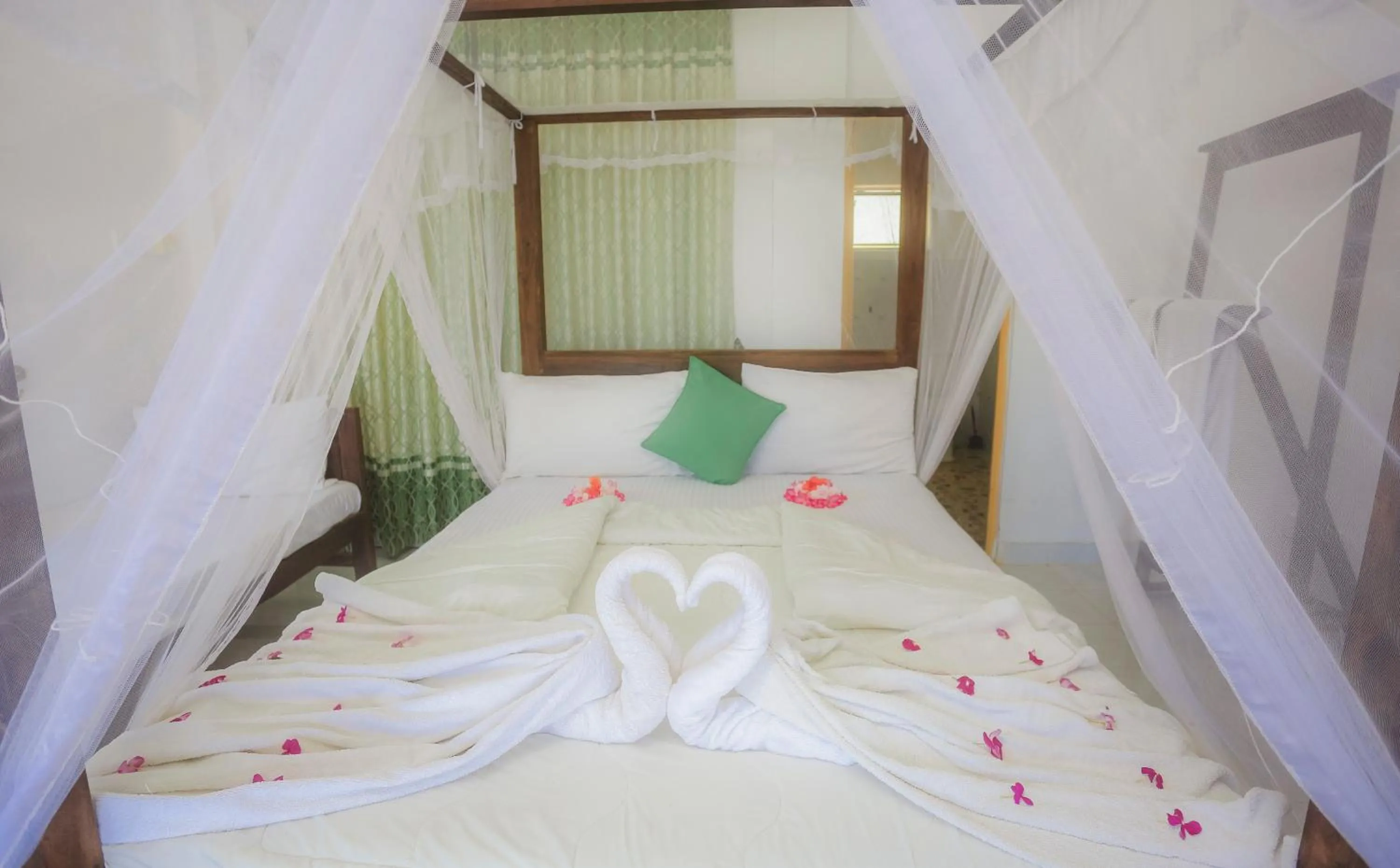 Bed in Dinuda Lagoon Hotel