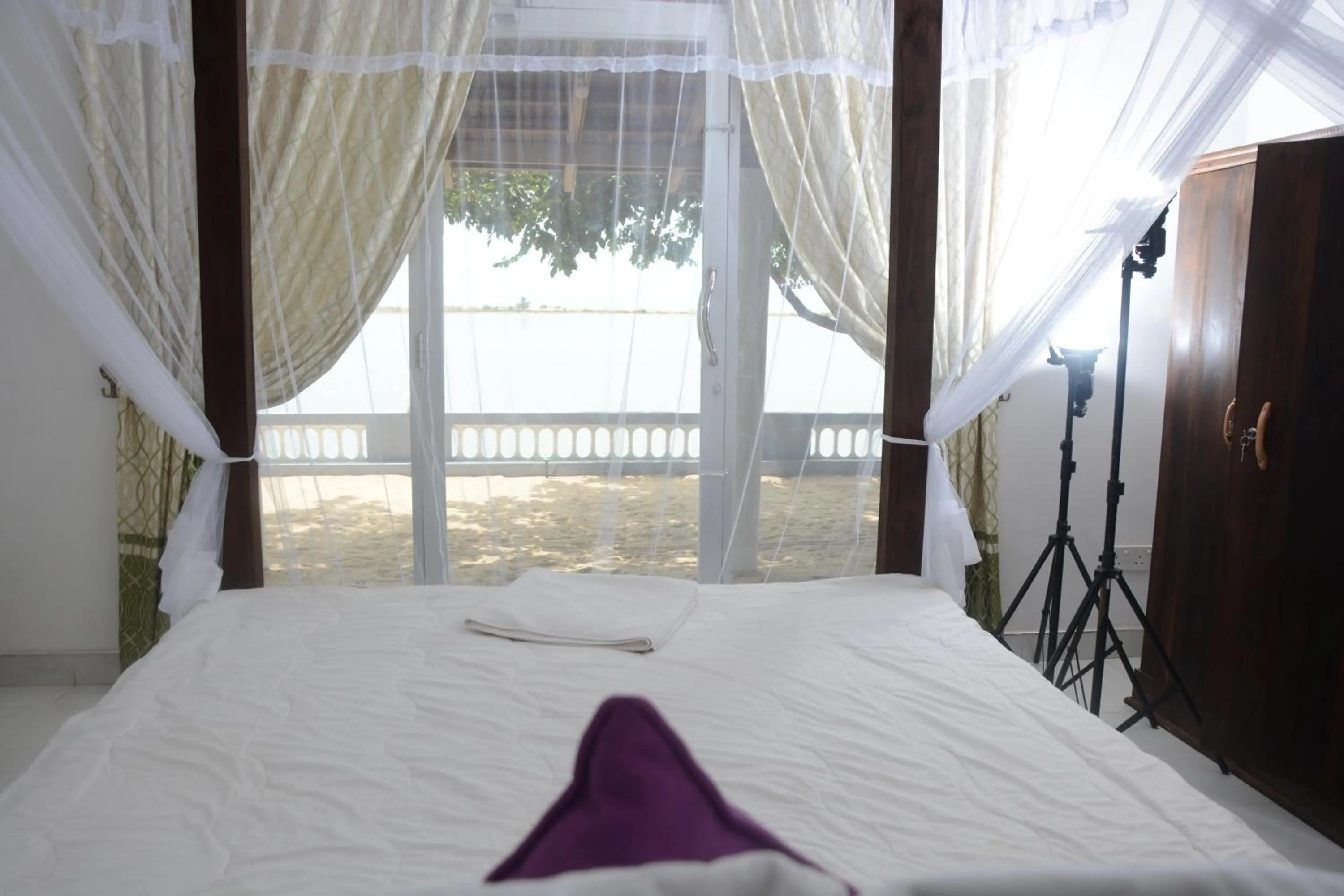Bed in Dinuda Lagoon Hotel