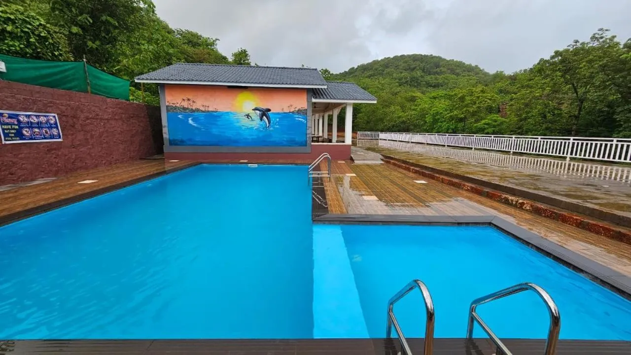 Swimming pool in Nisarg Resort